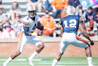 AUBURN, AL - APRIL 9: Wide receiver Jason Smith #4 of the Auburn Tigers looks to maneuver by wide receiver Jamel Dean #12 of the Auburn Tigers at Jordan Hare Stadium on April 9, 2016 in Auburn, Alabama. (Photo by Michael Chang/Getty Images)