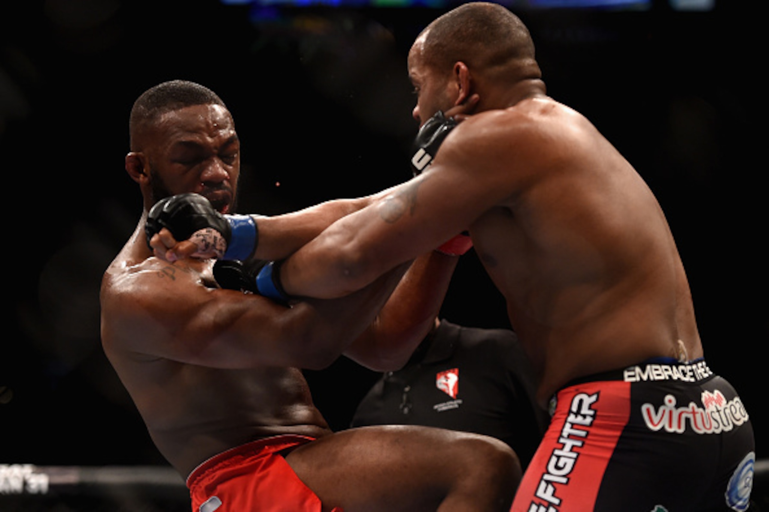 LAS VEGAS, NV - JANUARY 03:  Jon Jones (L) and Daniel Cormier (R) exchange punches in their UFC light heavyweight championship bout during the UFC 182 event at the MGM Grand Garden Arena on January 3, 2015 in Las Vegas, Nevada.  (Photo by Jeff Bottari/Zuf
