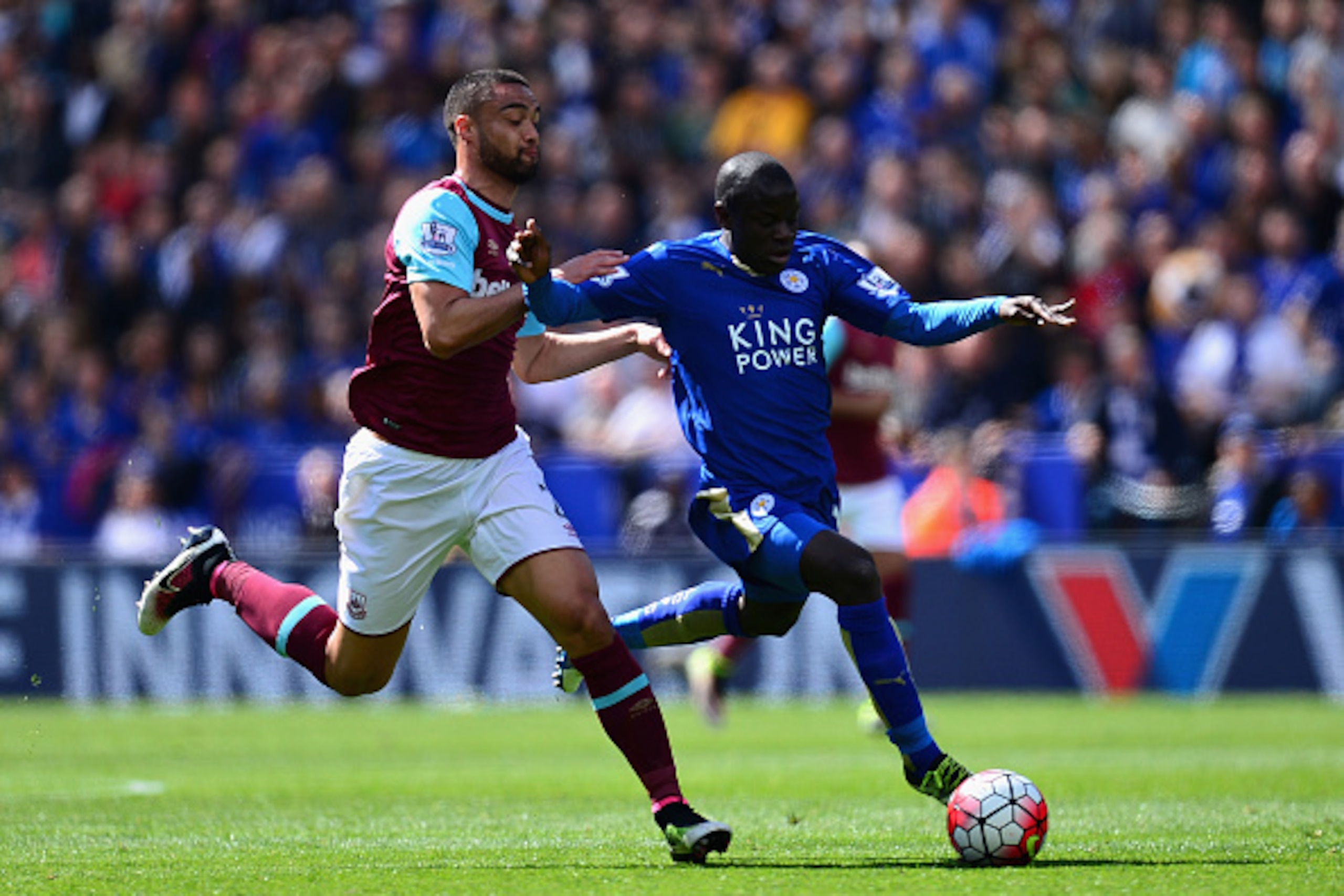 LEICESTER, ENGLAND - APRIL 17: Ngolo Kante of Leicester City holds off pressure from Winston Reid of West Ham United  during the Barclays Premier League match between Leicester City and West Ham United at The King Power Stadium on April 17, 2016 in Leices