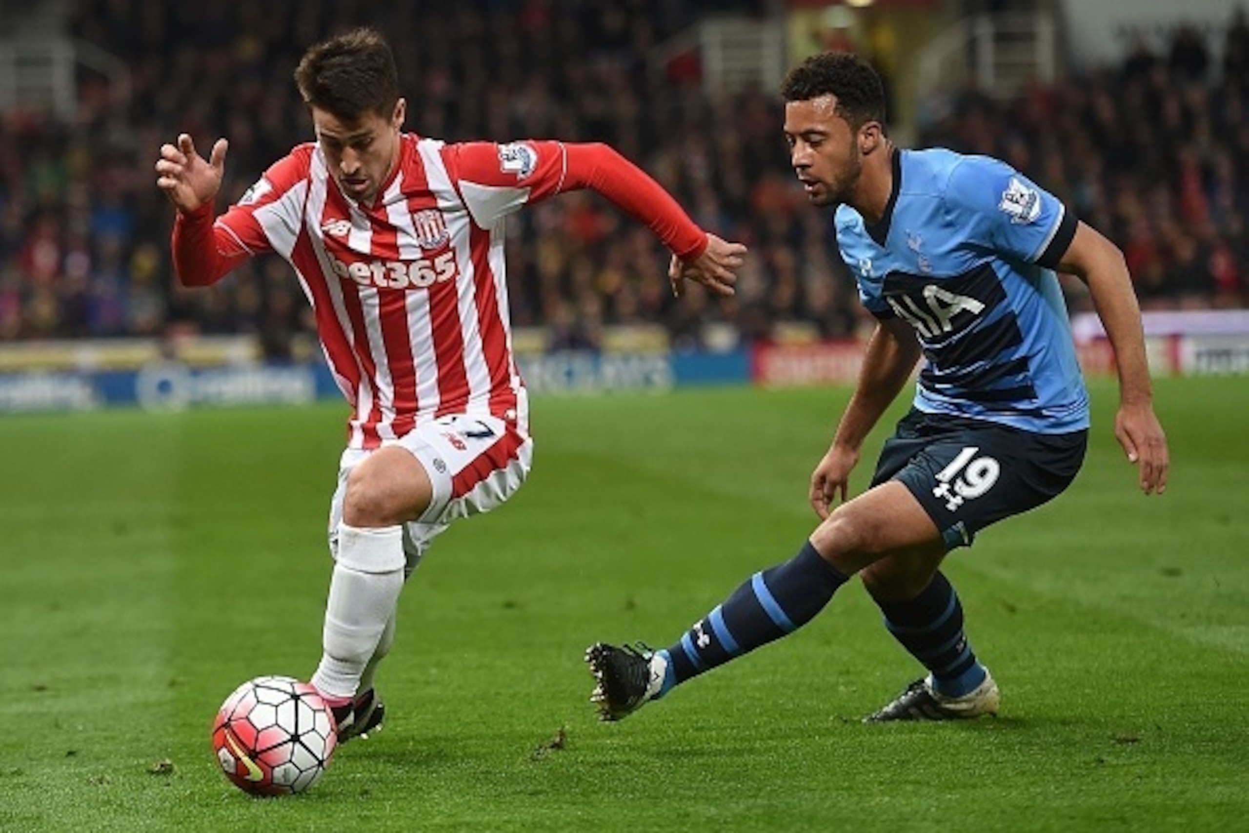 Stoke City's Spanish striker Bojan Krkic (L) is challenged by Tottenham Hotspur's Belgian midfielder Mousa Dembele during the English Premier League football match between Stoke City and Tottenham Hotspur at the Britannia Stadium in Stoke-on-Trent, centra
