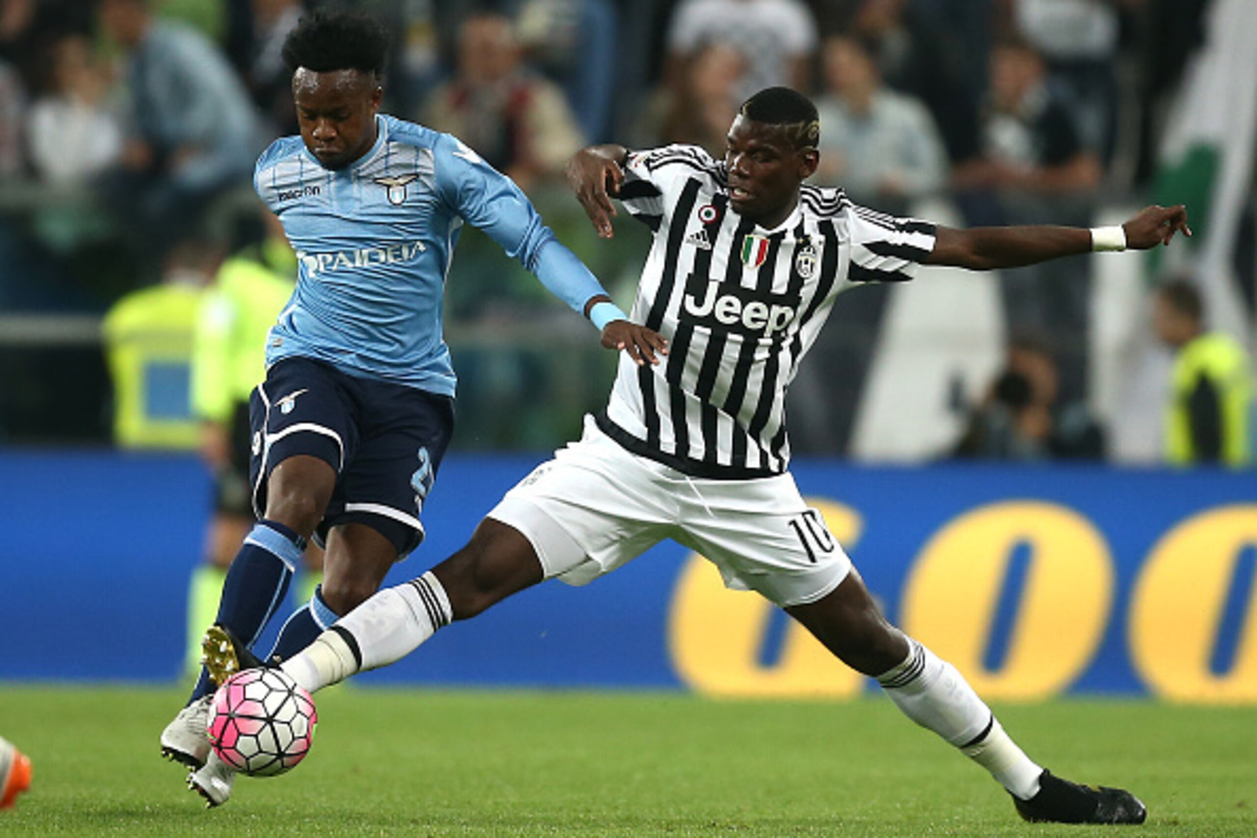 Lazio's midfielder Ogenyi Eddy Onazi of Nigeria (L) fights for the ball with Juventus' midfielder Paul Pogba from France during the Italian Serie A football match Juventus Vs Lazio on April 20, 2016 at the 'Juventus Stadium' in Turin.  / AFP / MARCO BERTO