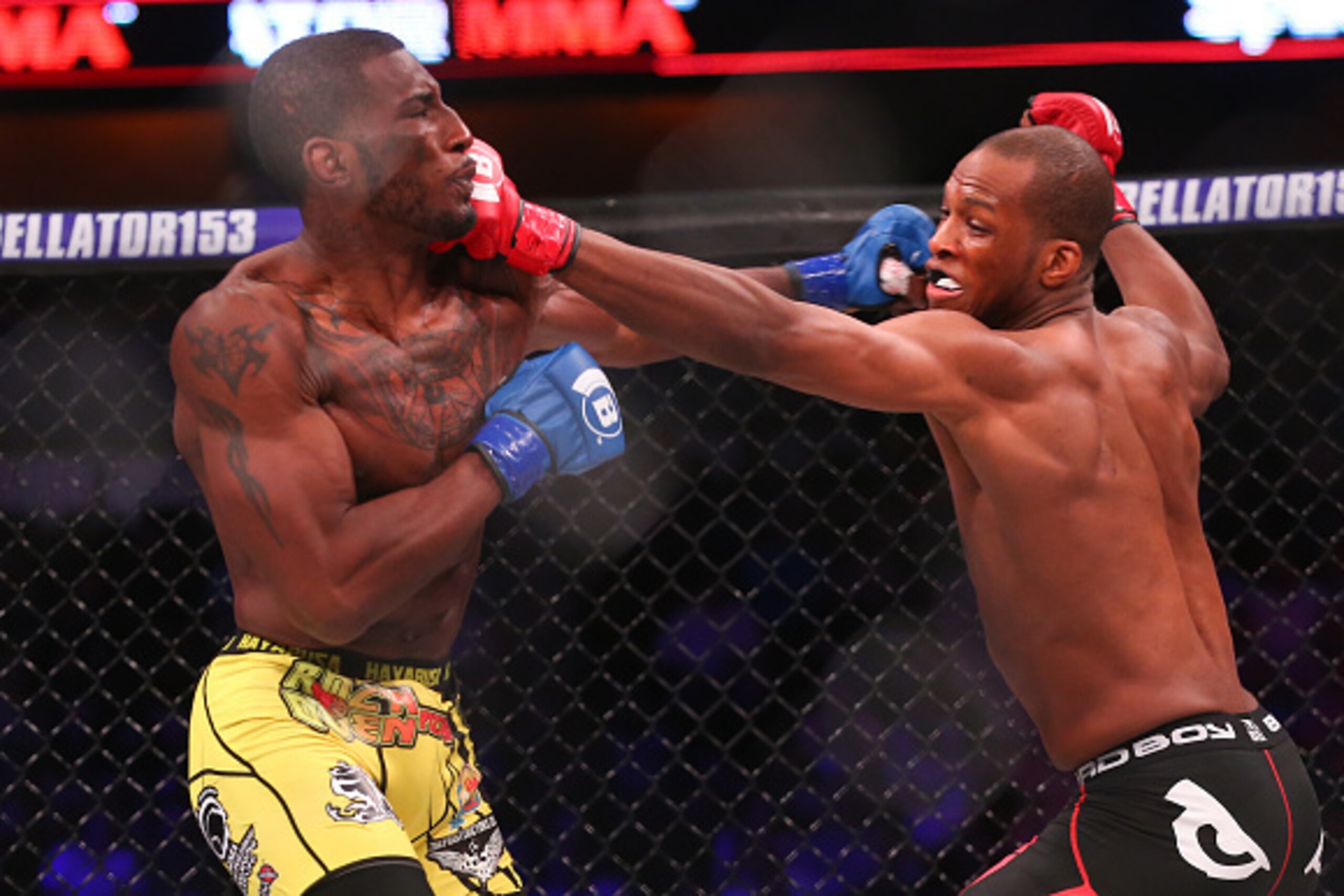 UNCASVILLE, CT - APRIL 22: Jeremie Holloway (yellow trunks) and Michael Page (black trunks) trade punches during their bout at Bellator 153  at Mohegan Sun Arena on April 22, 2016 in Uncasville, Connecticut. (Photo by Ed Mulholland/Getty Images)