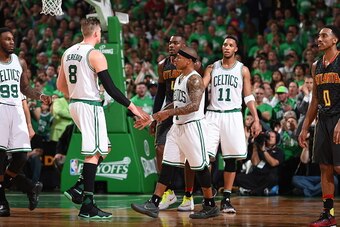 BOSTON, MA  - APRIL 22: Isaiah Thomas #4 high fives teammate Jonas Jerebko #8 of the Boston Celtics during Game Three of the Eastern Conference Quarterfinals during the 2016 NBA Playoffs against the Atlanta Hawks on April 22, 2016 at TD Garden in Boston, 