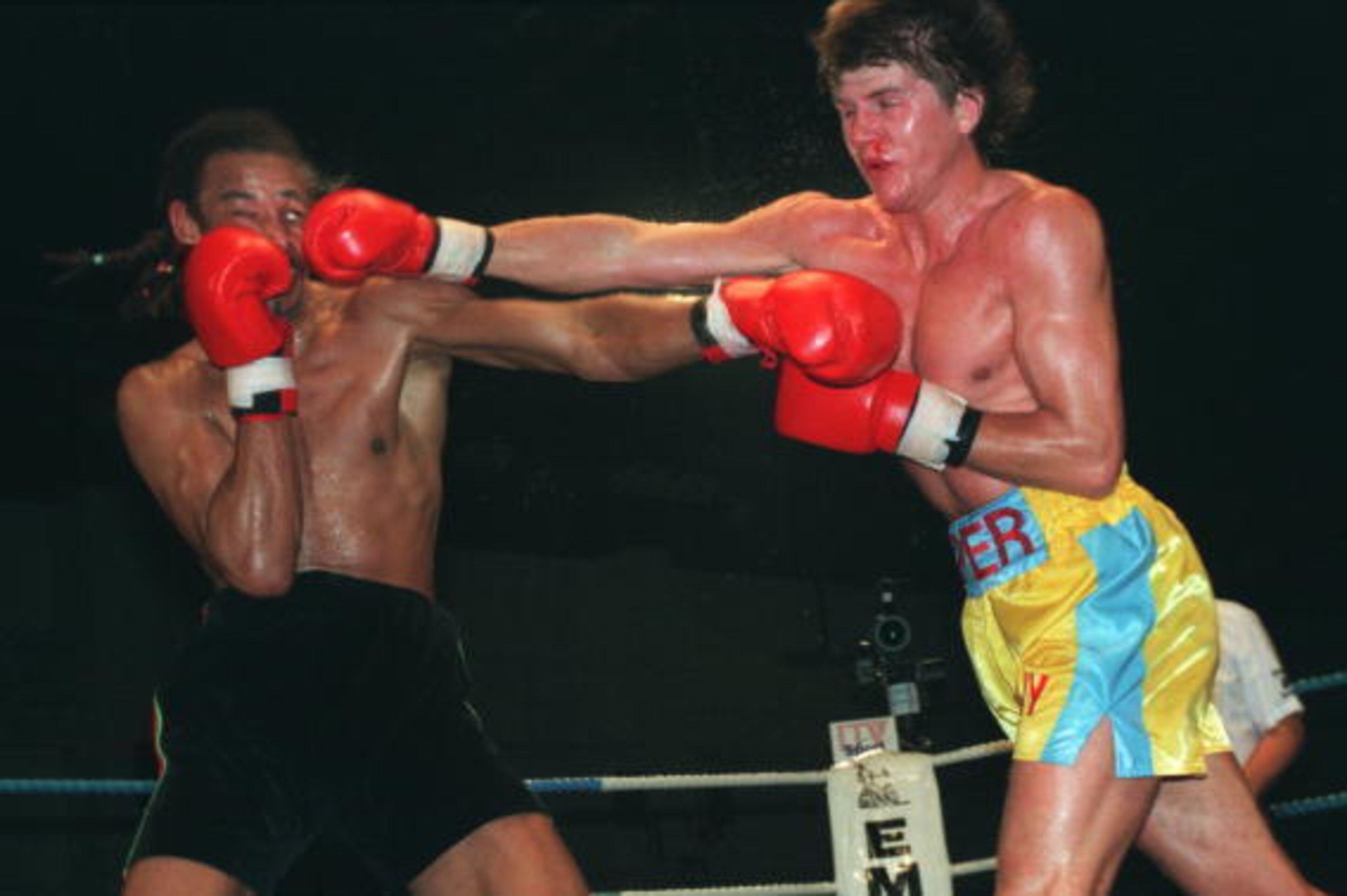 19 NOV 1994:  NICKY PIPER OF WALES CONNECTS WITH A RIGHT HAND PUNCH TO THE FACE OF CRAWFORD ASHLEY OF ENGLAND DURING THEIR LIGHT HEAVYWEIGHT FIGHT IN CARDIFF. ASHLEY WENT ON TO WIN THE FIGHT. Mandatory Credit: John Gichigi/ALLSPORT