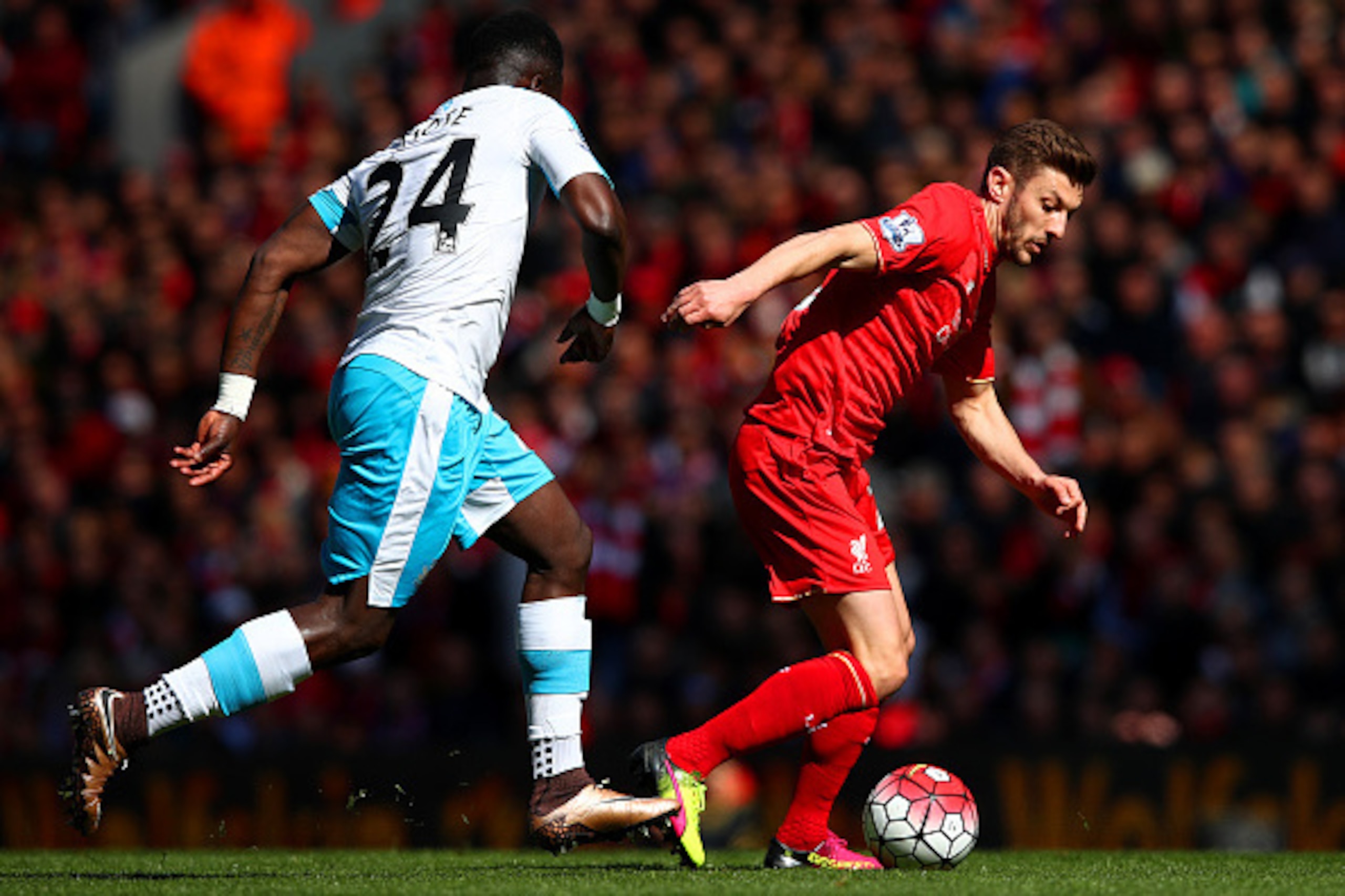 LIVERPOOL, ENGLAND - APRIL 23:  Cheik Ismael Tiote of Newcastle United chases down Adam Lallana of Liverpool  during the Barclays Premier League match between Liverpool and Newcastle United at Anfield on April 23, 2016 in Liverpool, United Kingdom.  (Phot