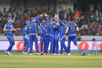Mumbai Indians' Tim Southee (C) celebrate with teammates the wicket of Sunrisers Hyderabad Shikhar Dhawan during the 2016 Indian Premier League (IPL) Twenty20 cricket match between Sunrisers Hyderabad and  Mumbai Indians at The Rajiv Gandhi International 