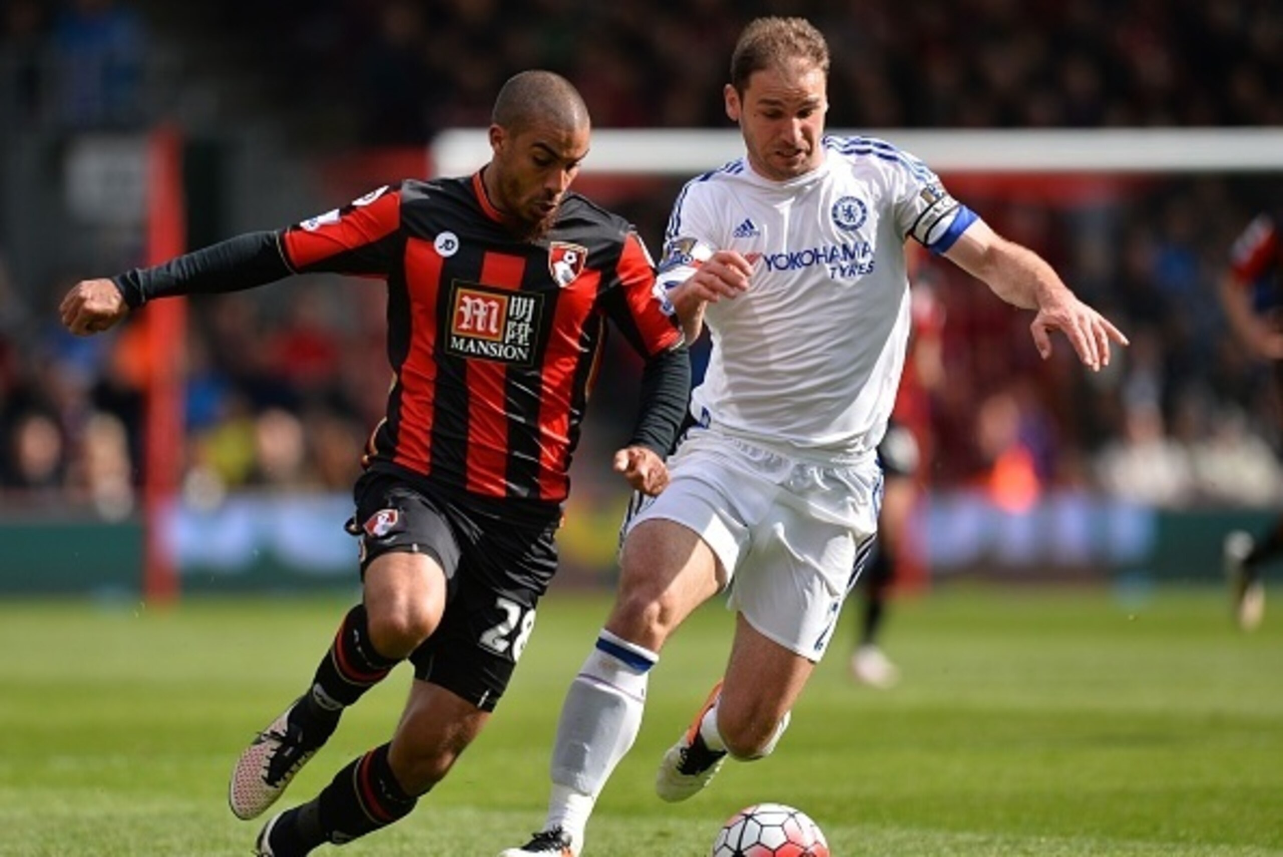 Bournemouth's English born Jamaican striker Lewis Grabban (L) vies with Chelsea's Serbian defender Branislav Ivanovic during the English Premier League football match between Bournemouth and Chelsea at the Vitality Stadium in Bournemouth, southern England