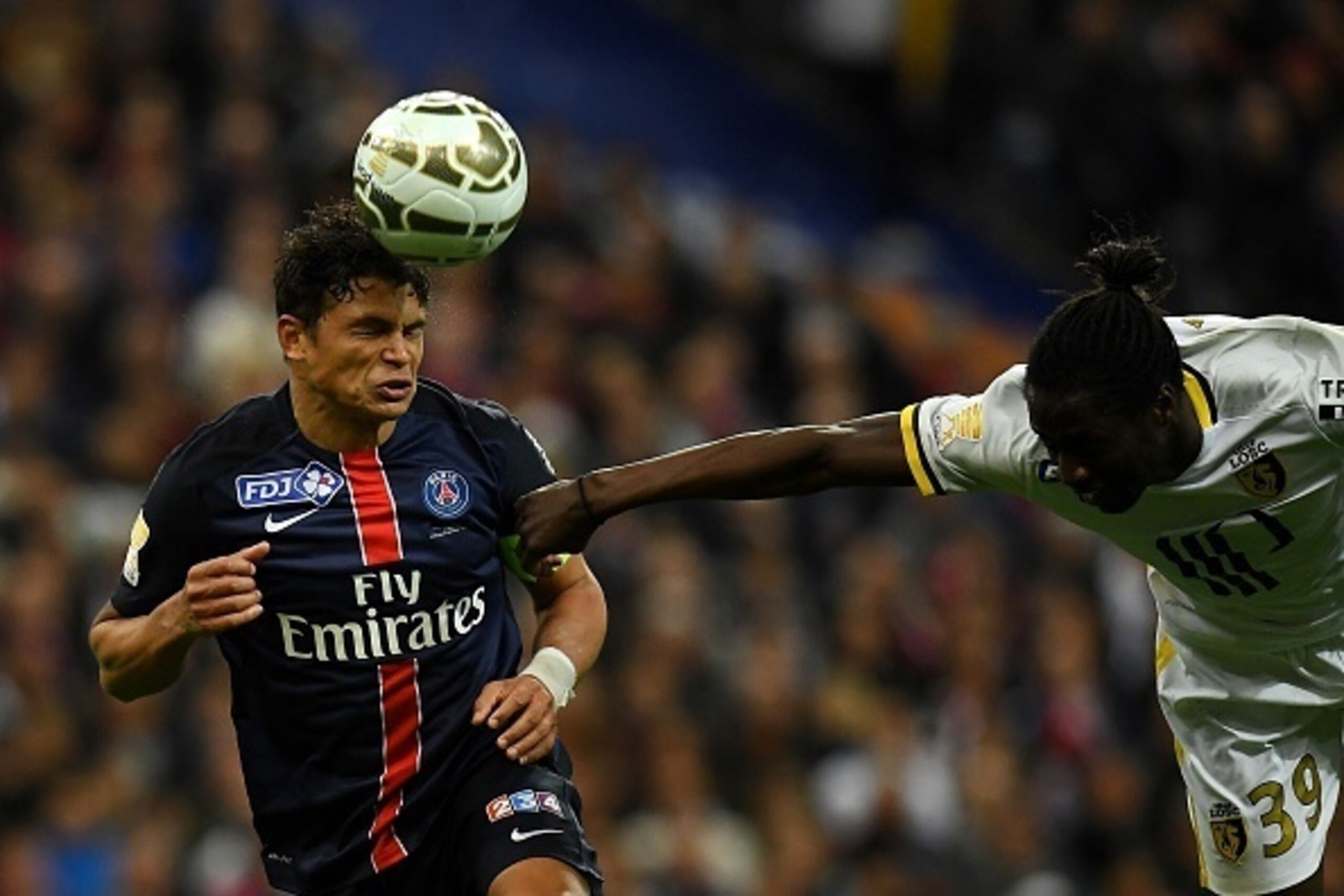 Paris Saint-Germain's Brazilian defender Thiago Silva (L) and Lille's Portuguese forward Eder go for a header during the French League Cup final football match Paris Saint-Germain (PSG) vs Lille (LOSC) on April 23, 2016 at the Stade de France stadium in S