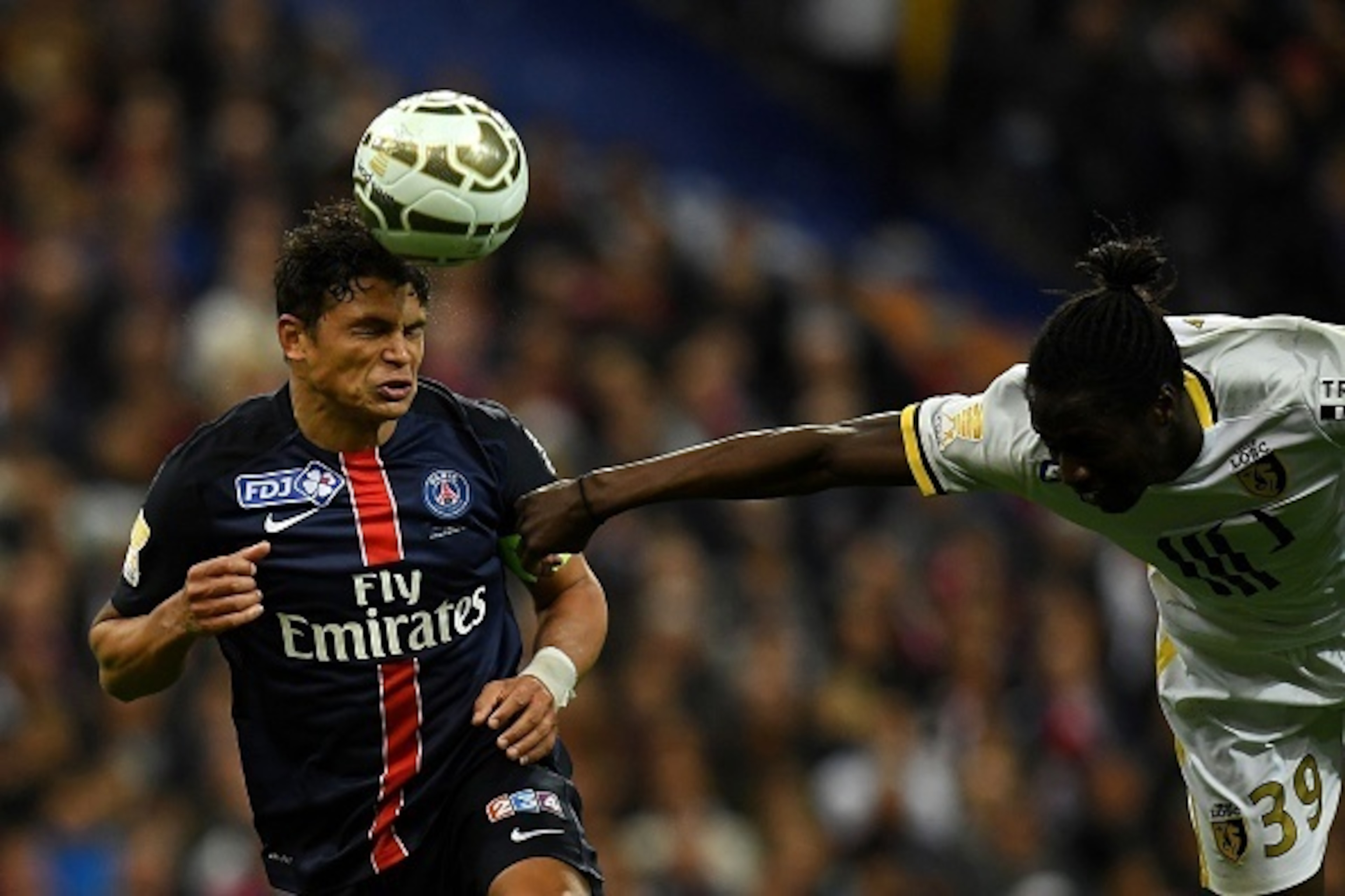 Paris Saint-Germain's Brazilian defender Thiago Silva (L) and Lille's Portuguese forward Eder go for a header during the French League Cup final football match Paris Saint-Germain (PSG) vs Lille (LOSC) on April 23, 2016 at the Stade de France stadium in S