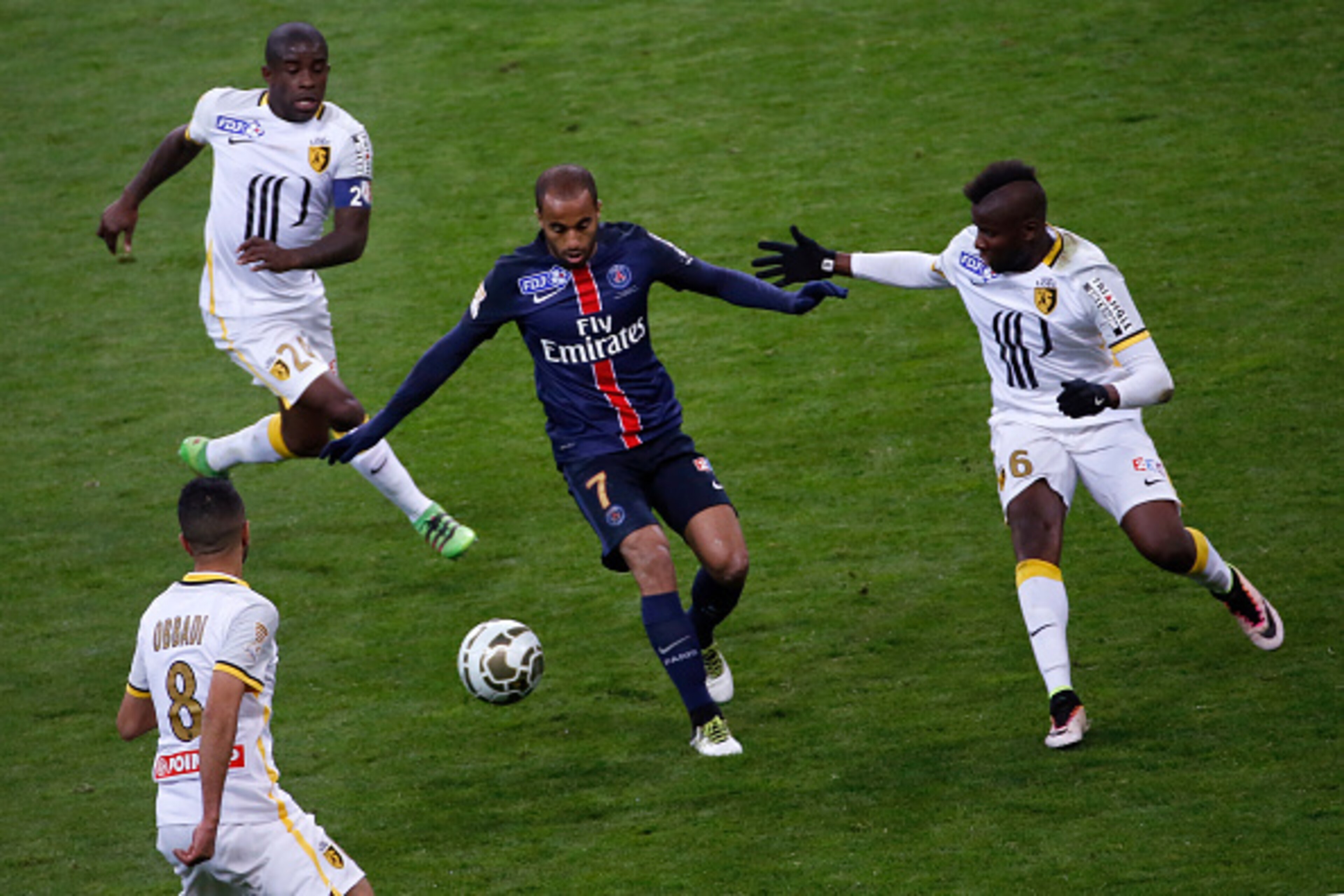 Paris Saint-Germain's Brazilian midfielder Lucas (C) vies with Lille's Moroccan midfielder Mounir Obbadi (L), Lille's French midfielder Rio Mavuba (2nd L) and Lille's French midfielder Ibrahim Amadou (R) during the French League Cup final football match b