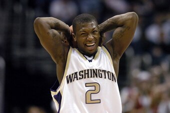 Nate Robinson of Washington grimaces after picking up his fourth foul during 66-63 victory over Stanford in the Pacific Life Pac-10  Tournament men's basketball semifinals at the Staples Center in Los Angeles, California on Friday, March 11, 2005. (Photo 