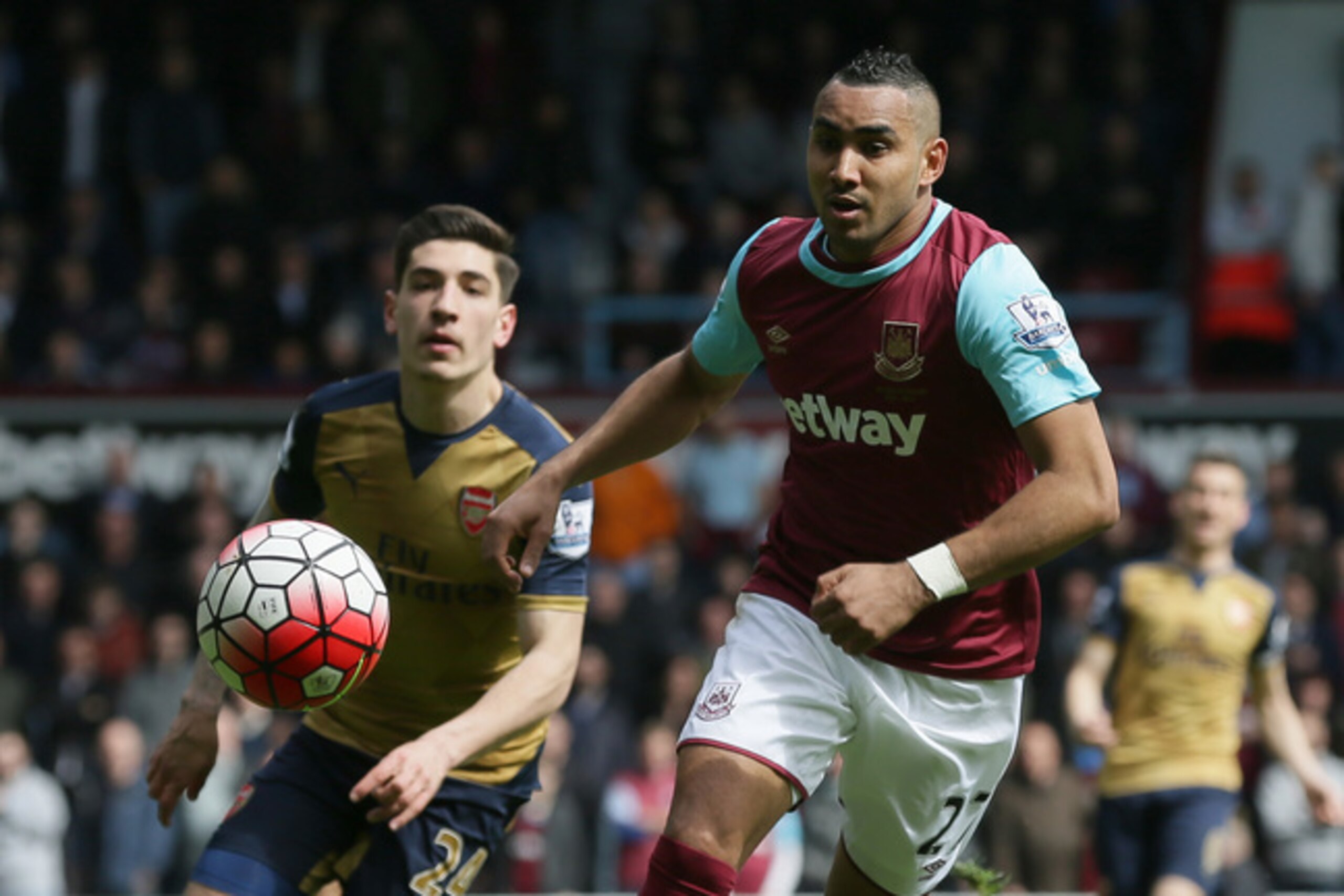 Payet holds off fellow team of the year member Hector Bellerin. Payet holds off fellow team of the year member Hector Bellerin.