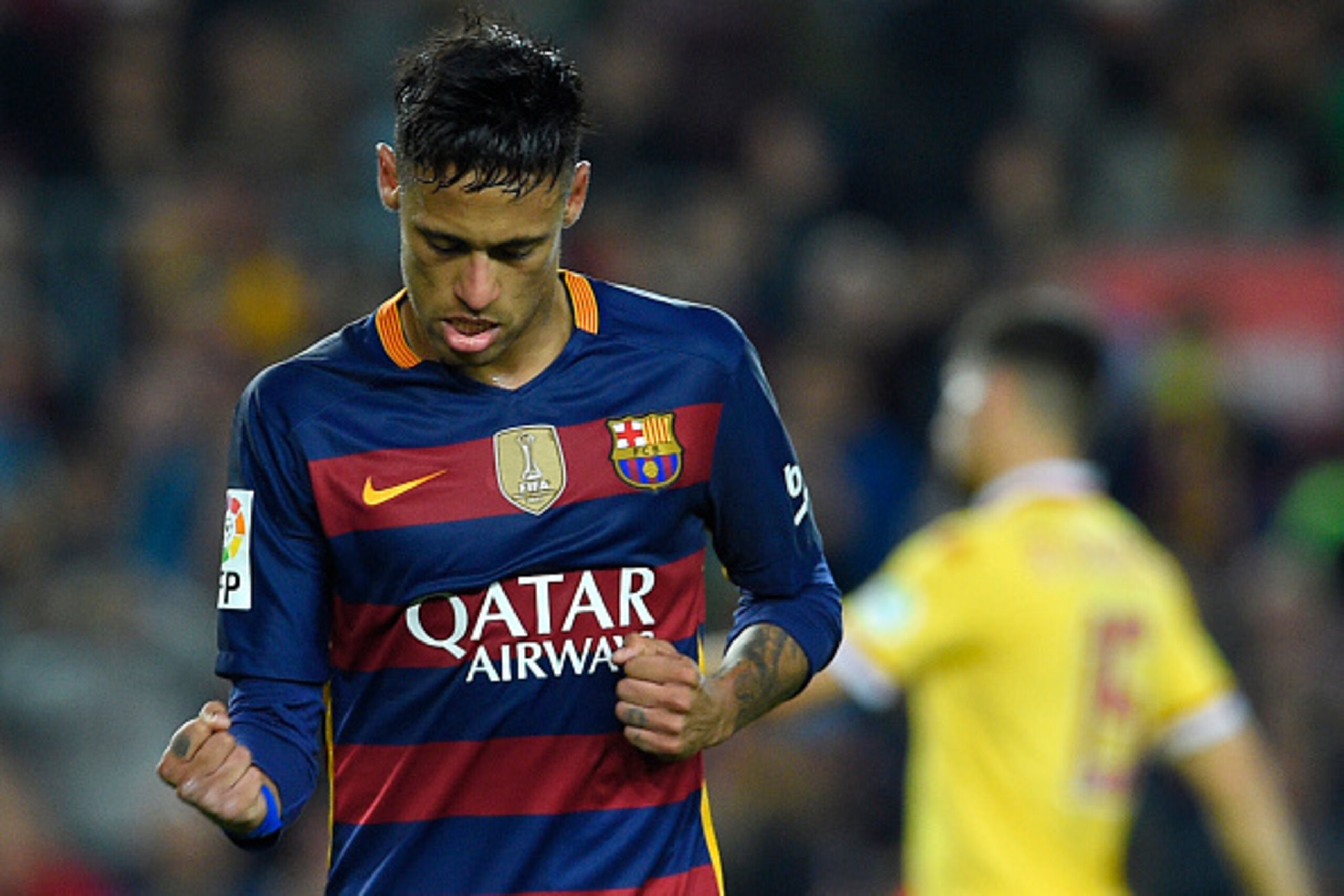 Barcelona's Brazilian forward Neymar celebrates after scoring during the Spanish league football match FC Barcelona vs Real Sporting de Gijï¿½ï¿½n at the Camp Nou stadium in Barcelona on April 23, 2016. / AFP / LLUIS GENE        (Photo credit should read LLUI