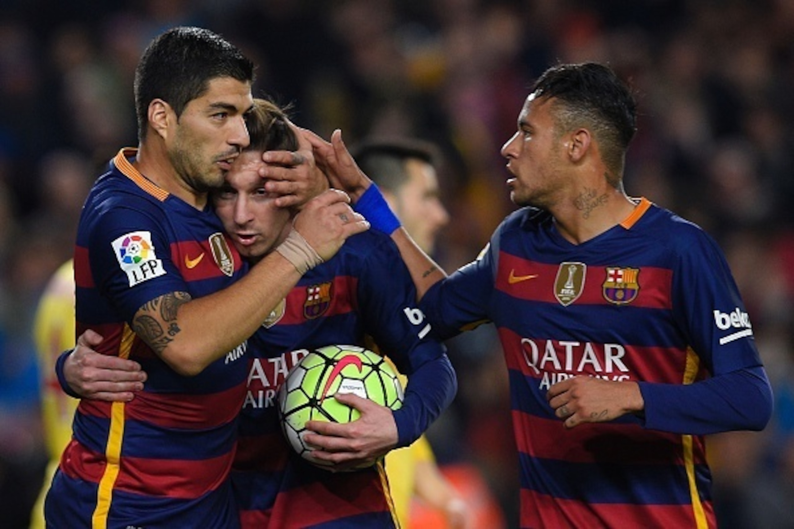 Barcelona's Uruguayan forward Luis Suarez (L) celebrates with Barcelona's Argentinian forward Lionel Messi (C) and Barcelona's Brazilian forward Neymar after scoring during the Spanish league football match FC Barcelona vs Real Sporting de Gijï¿½ï¿½n at the C