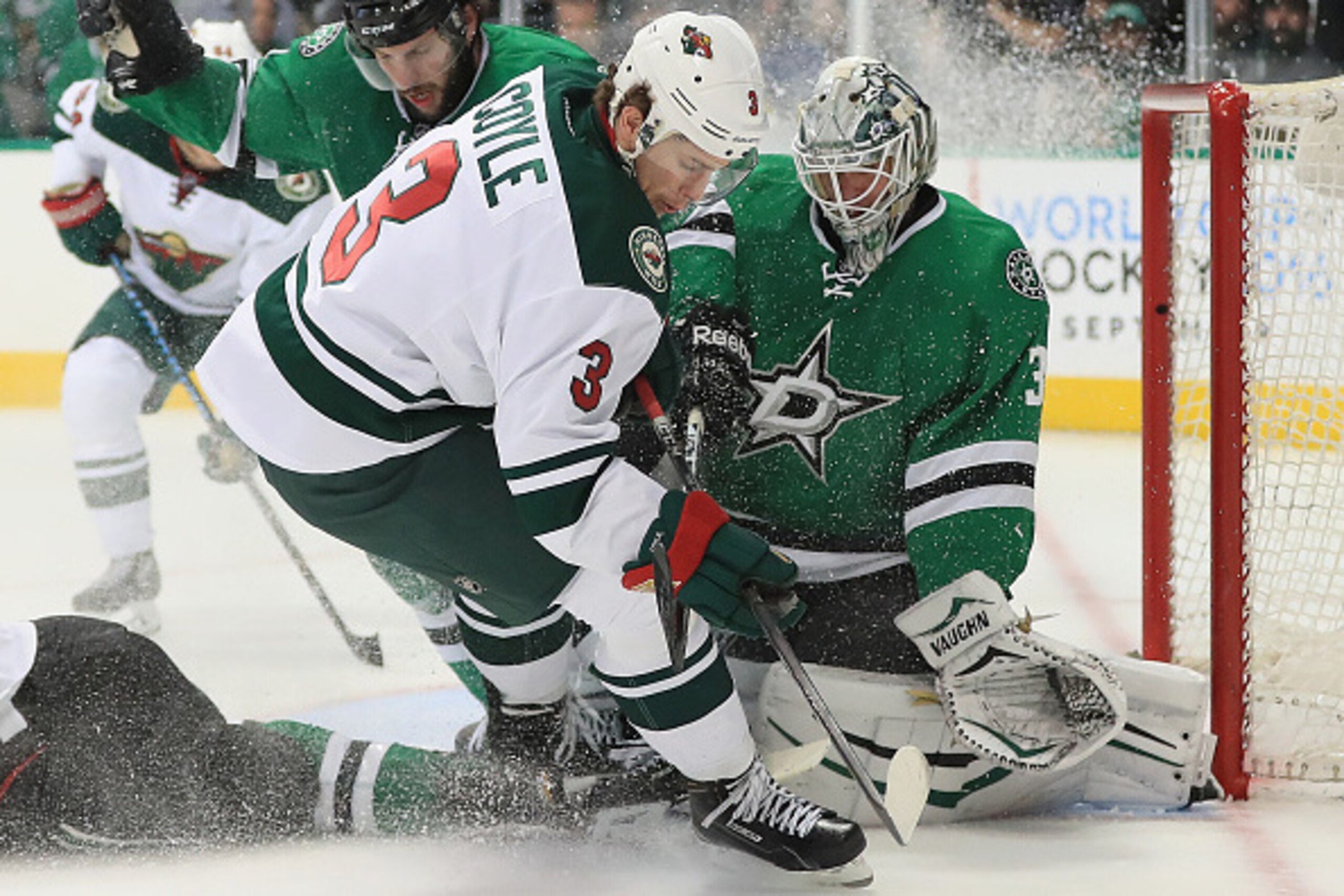 DALLAS, TX - APRIL 22:  Charlie Coyle #3 of the Minnesota Wild skates into Antti Niemi #31 of the Dallas Stars in the second period in Game Five of the Western Conference First Round during the 2016 NHL Stanley Cup Playoffs at American Airlines Center on 