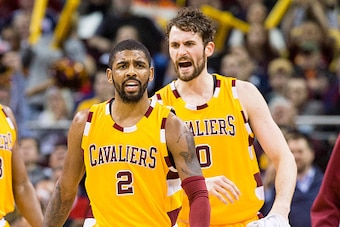 CLEVELAND, OH - APRIL 11: Kyrie Irving #2 and Kevin Love #0 of the Cleveland Cavaliers celebrate during the second half against the Atlanta Hawks at Quicken Loans Arena on April 11, 2016 in Cleveland, Ohio. The Cavaliers defeated the Hawks 109-94. NOTE TO