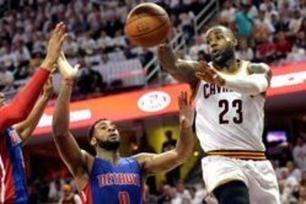 Apr 17, 2016; Cleveland, OH, USA; Cleveland Cavaliers forward LeBron James (23) passes the ball as Detroit Pistons center Andre Drummond (0) defends during the second half in game one of the first round of the NBA Playoffs at Quicken Loans Arena. The Cavs