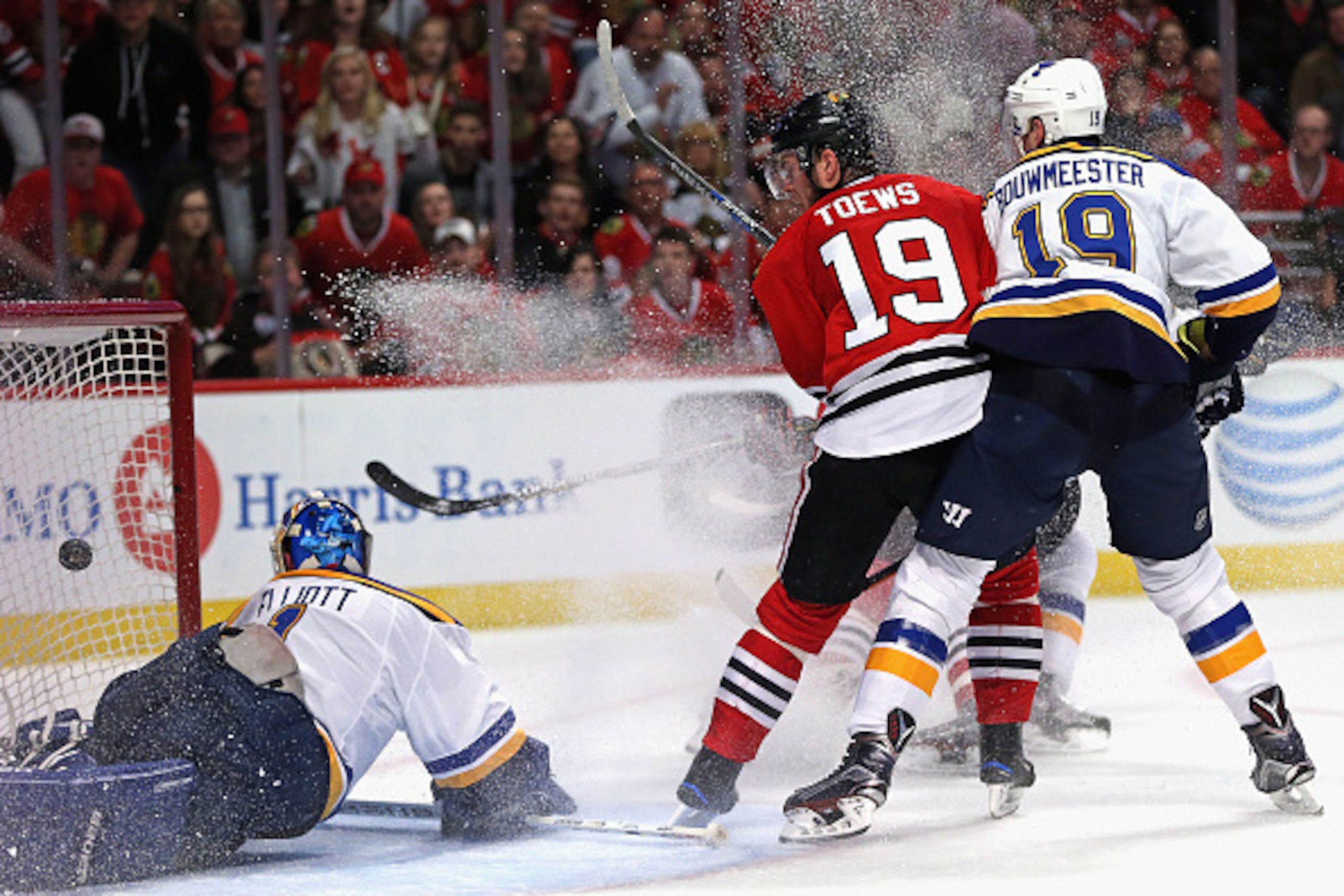 CHICAGO, IL - APRIL 23: Jonathan Toews #19 of the Chicago Blackhawks watches as the puck slips past Brian Elliott #1 of the St. Louis Blues on a goal by Trevor van Riemsdyk of the Blackhawks in the second period in Game Six of the Western Conference First
