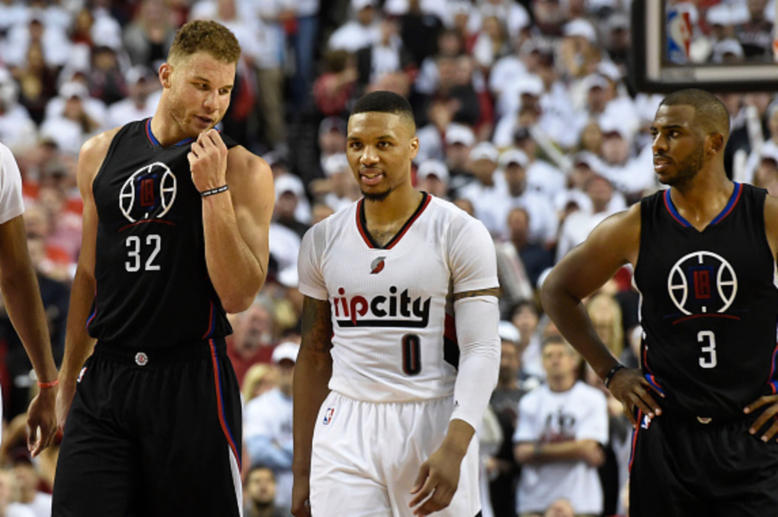 PORTLAND, OR - APRIL 23: Blake Griffin #32 of the Los Angeles Clippers has some words with Damian Lillard #0 of the Portland Trail Blazers as Chris Paul #3 of the Los Angeles Clippers looks on in the fourth quarter of Game Three of the Western Conference 
