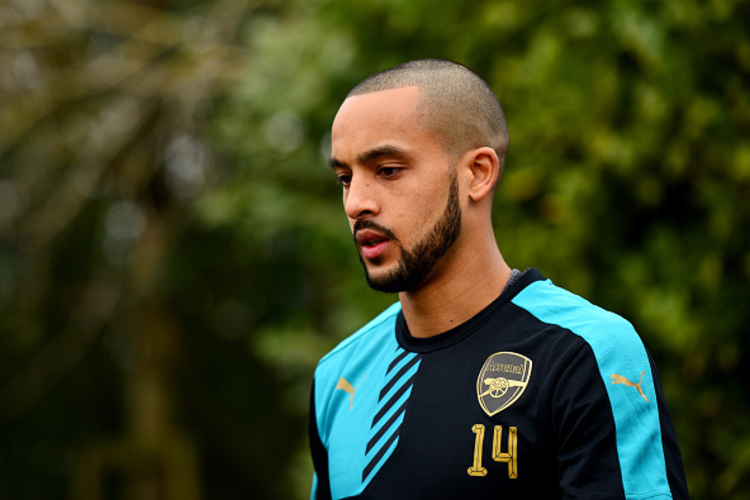 ST ALBANS, ENGLAND - MARCH 15: Theo Walcott of Arsenal walks out for a training session ahead of the UEFA Champions League round of 16 second leg match between Barcelona and Arsenal at London Colney on March 15, 2016 in St Albans, England. (Photo by Dan ST ALBANS, ENGLAND - MARCH 15: Theo Walcott of Arsenal walks out for a training session ahead of the UEFA Champions League round of 16 second leg match between Barcelona and Arsenal at London Colney on March 15, 2016 in St Albans, England. (Photo by Dan