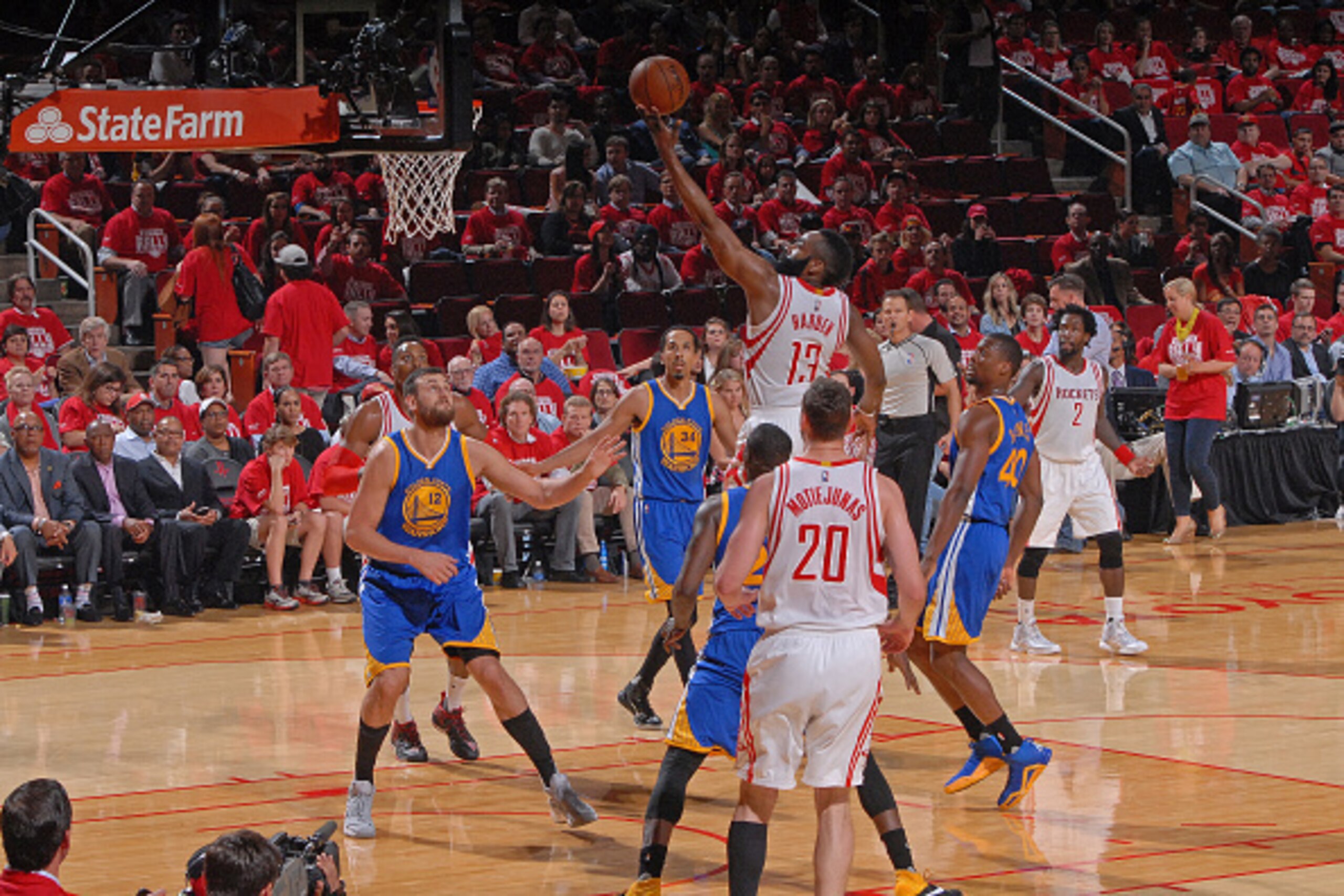 HOUSTON, TX - APRIL 21:  James Harden #13 of the Houston Rockets drives to the basket against the Golden State Warriors in Game Three of the Western Conference Quarterfinals during the 2016 NBA Playoffs on April 21, 2016 at the Toyota Center in Houston, T