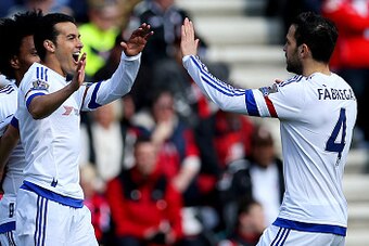 BOURNEMOUTH, ENGLAND - APRIL 23: Pedro of Chelsea celebrates with Sesc Fabregas of Chelsea after scoring the opening goal  during the Barclays Premier League match between A.F.C. Bournemouth and Chelsea at the Vitality Stadium on April 23, 2016 in Bournem