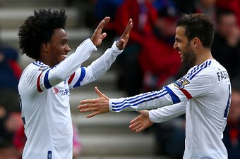 BOURNEMOUTH, ENGLAND - APRIL 23: Willian of Chelsea celebrates with Cesc Fabregas of Chelsea after scoring his sides third goal during the Barclays Premier League match between A.F.C. Bournemouth and Chelsea at the Vitality Stadium on April 23, 2016 in Bo