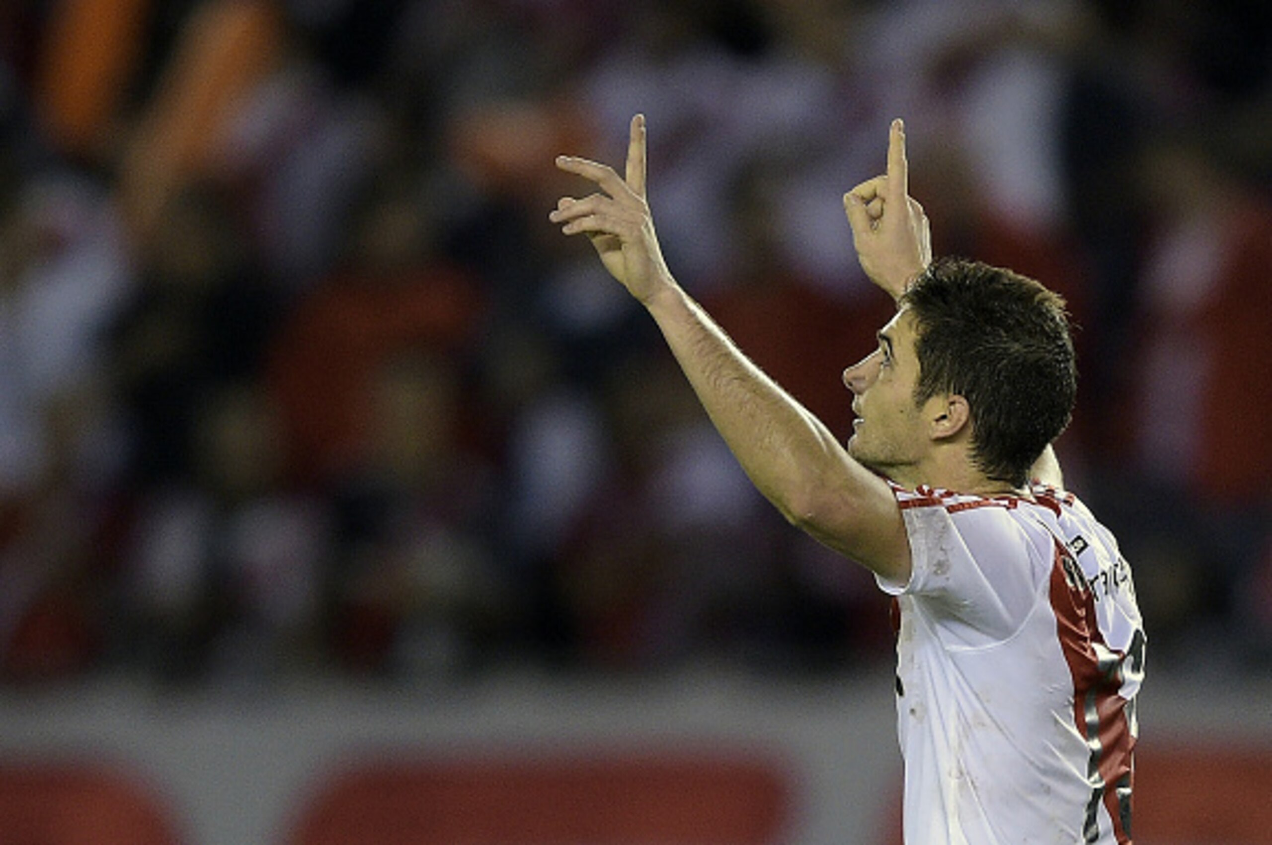 Argentina's River Plate forward Lucas Alario celebrates after scoring the team's fifth goal against Bolivia's The Strongest during the Copa Libertadores 2016 group 1 football match at the 'Monumental' stadium in Buenos Aires, Argentina, on April 6, 2016. 