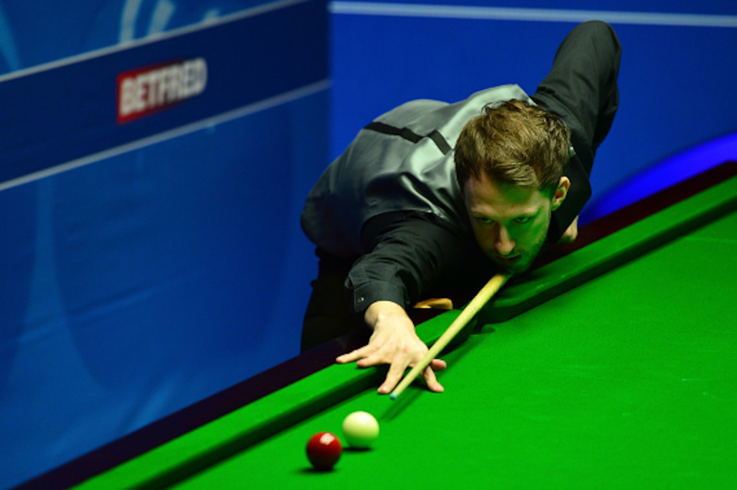 SHEFFIELD, ENGLAND - APRIL 21: Judd Trump of England plays a shot during his first round match against Liang Wenbo of China on day six of the World Snooker Championship at The Crucible Theatre on April 21, 2016 in Sheffield, England. (Photo by Dan Mulla SHEFFIELD, ENGLAND - APRIL 21: Judd Trump of England plays a shot during his first round match against Liang Wenbo of China on day six of the World Snooker Championship at The Crucible Theatre on April 21, 2016 in Sheffield, England. (Photo by Dan Mulla