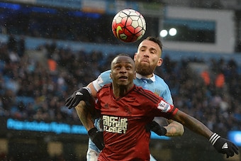 MANCHESTER, ENGLAND - APRIL 09: Saido Berahino of West Bromwich Albion challenges for the ball with Nicolas Otamendi of Manchester City during the Barclays Premier League match between Manchester City and West Bromwich Albion at the Etihad Stadium on Apri