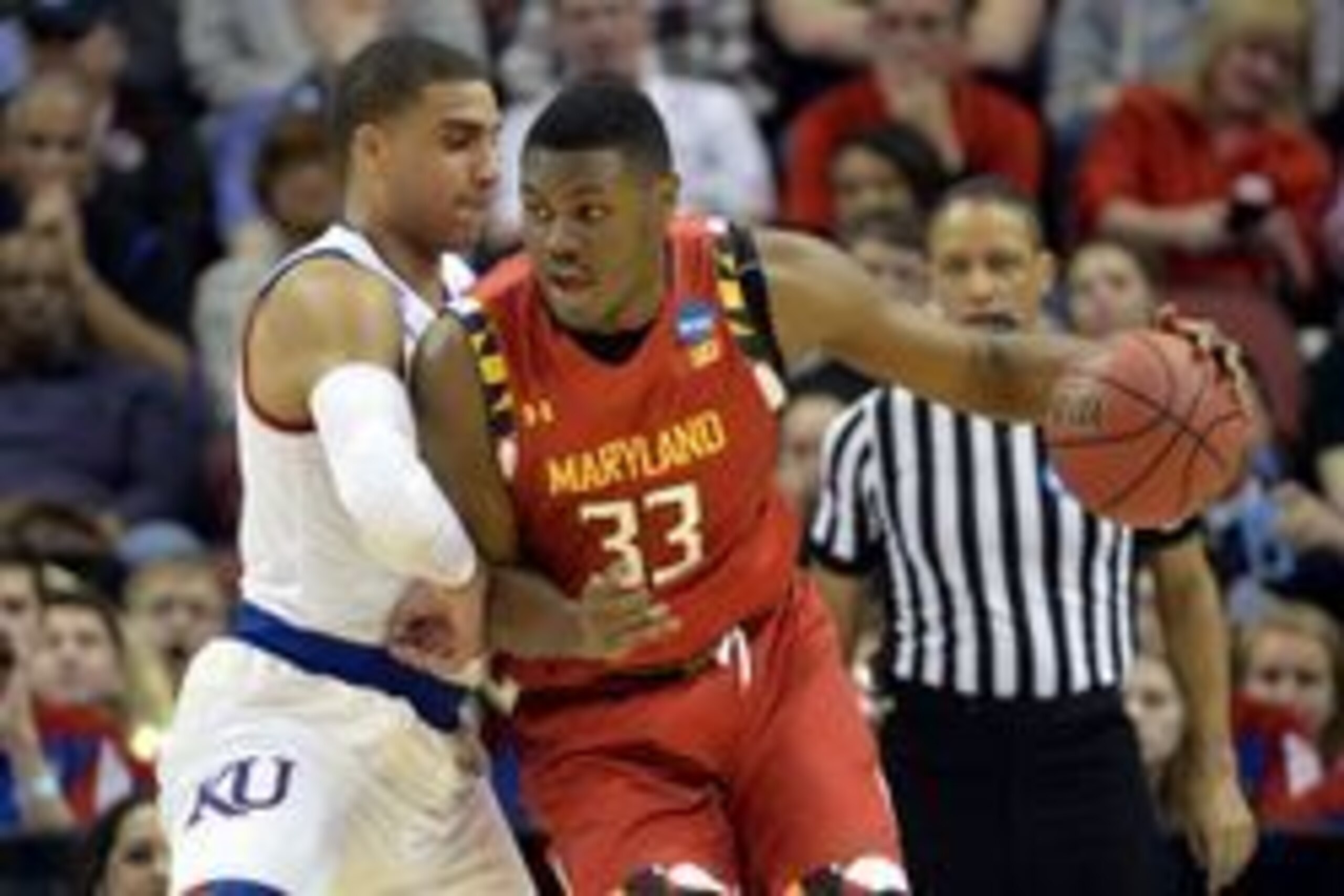 Mar 24, 2016; Louisville, KY, USA; Maryland Terrapins center Diamond Stone (33) drives to the basket agsint Kansas Jayhawks forward Landen Lucas (33) during the first half in a semifinal game in the South regional of the NCAA Tournament at KFC YUM!. Manda