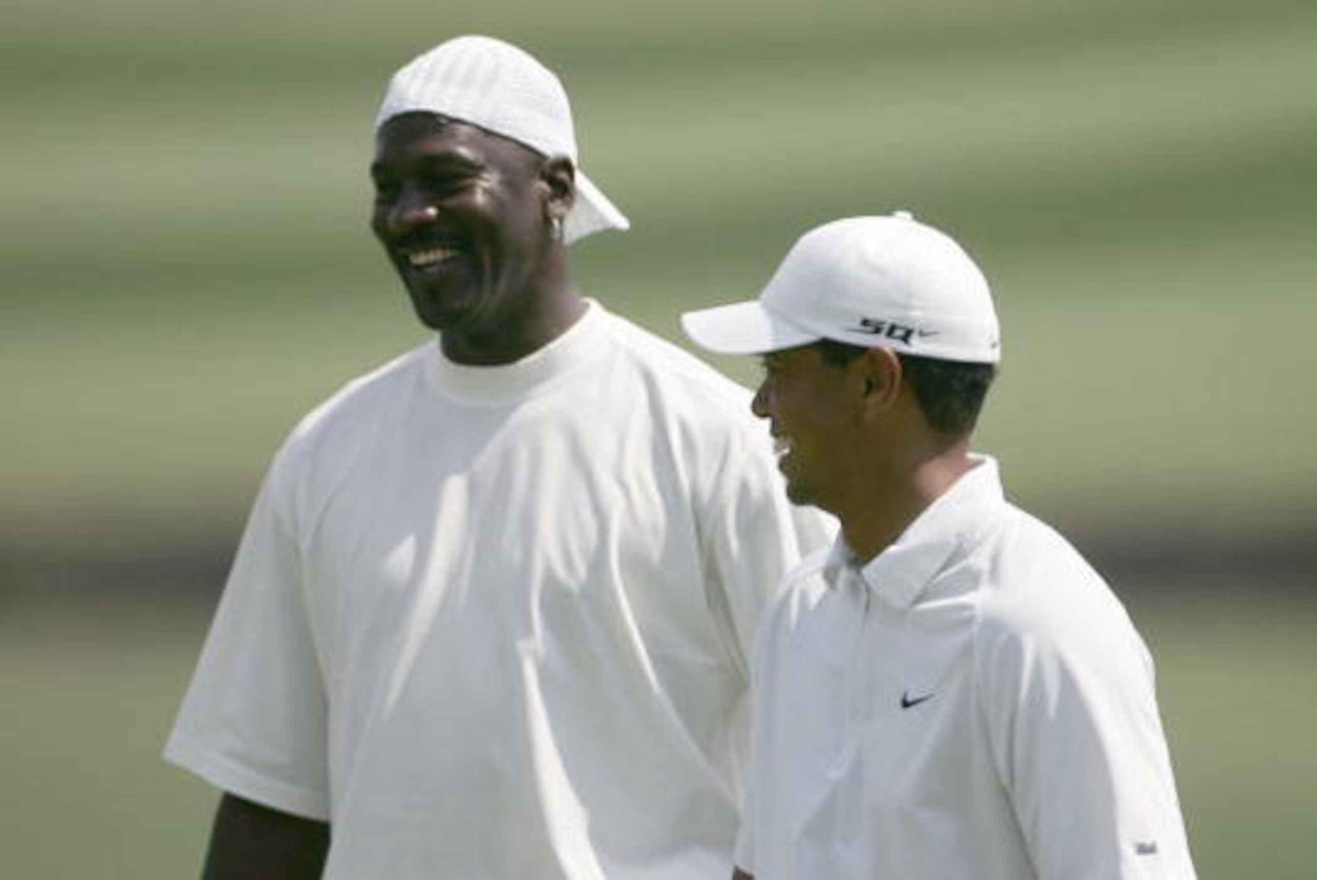 UNITED STATES - MAY 02: Michael Jordan and Tiger Woods during the Pro-Am prior to the 2007 Wachovia Championship held at Quail Hollow Country Club in Charlotte, North Carolina on May 2, 2007. (Photo by Sam Greenwood/Getty Images) UNITED STATES - MAY 02: Michael Jordan and Tiger Woods during the Pro-Am prior to the 2007 Wachovia Championship held at Quail Hollow Country Club in Charlotte, North Carolina on May 2, 2007. (Photo by Sam Greenwood/Getty Images)