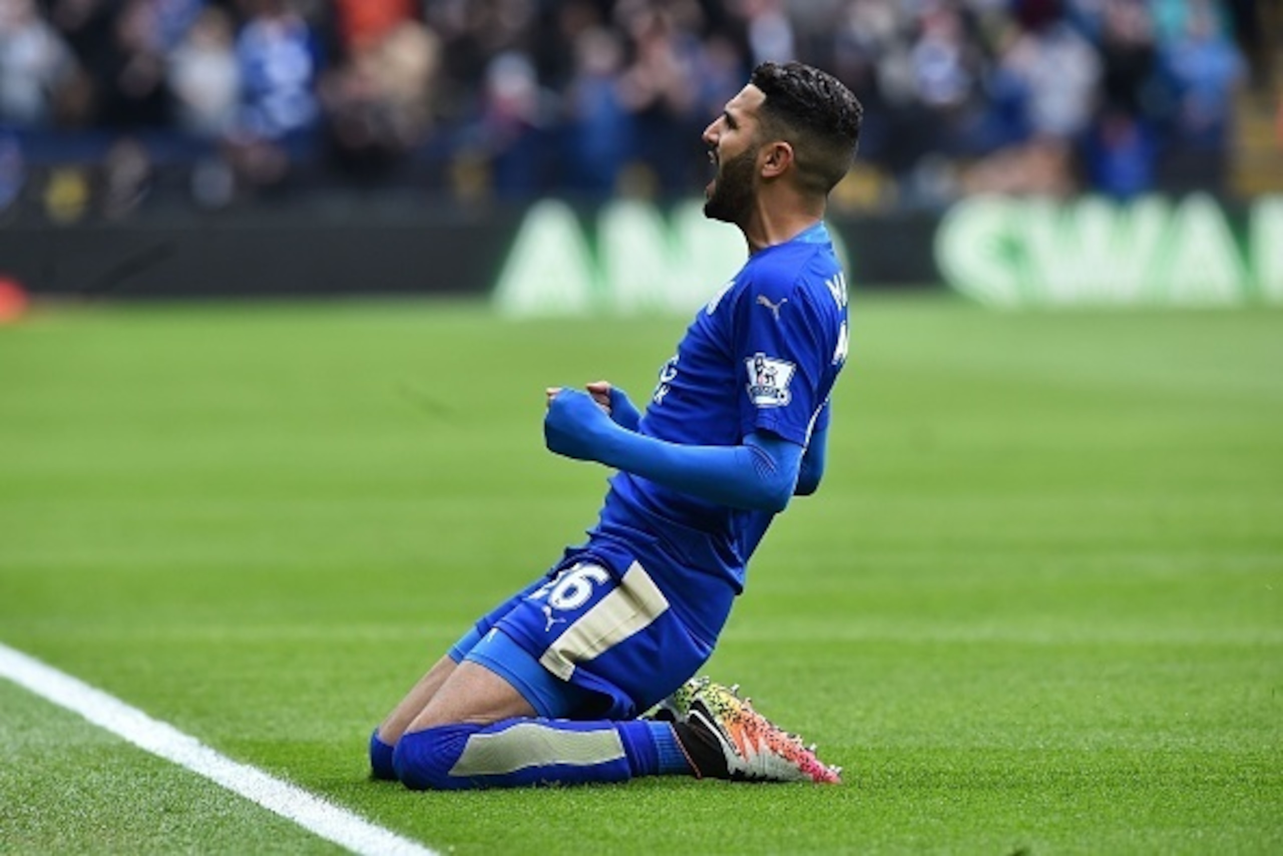 Leicester City's Algerian midfielder Riyad Mahrez celebrates scoring the opening goal during the English Premier League football match between Leicester City and Swansea at King Power Stadium in Leicester, central England on April 24, 2016. / AFP / BEN ST