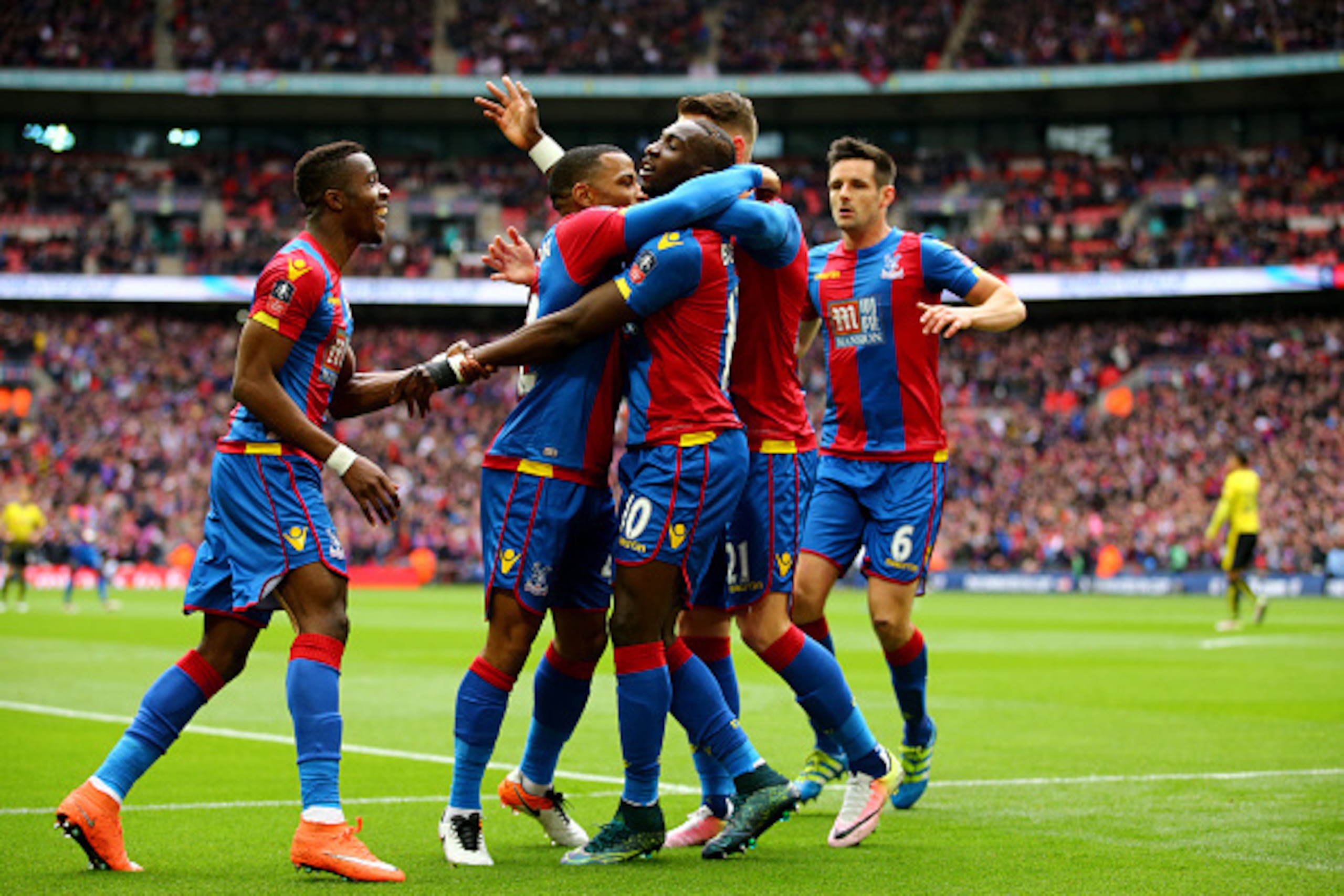 LONDON, ENGLAND - APRIL 24:  Yannick Bolasie of Crystal Palace (10) celebrates with team mates as he score their first goal during The Emirates FA Cup semi final match between Watford and Crystal Palace at Wembley Stadium on April 24, 2016 in London, Engl