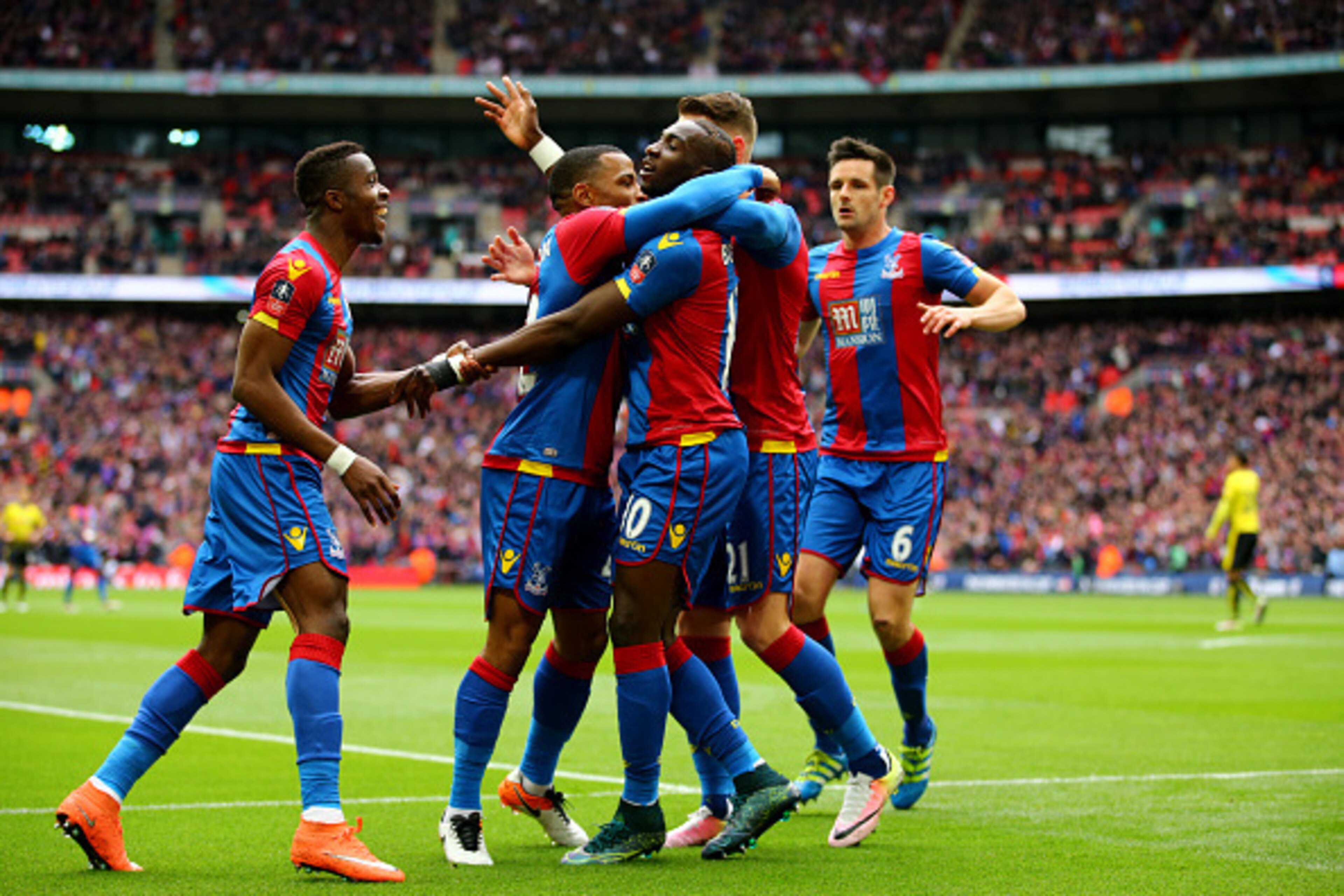 LONDON, ENGLAND - APRIL 24:  Yannick Bolasie of Crystal Palace (10) celebrates with team mates as he score their first goal during The Emirates FA Cup semi final match between Watford and Crystal Palace at Wembley Stadium on April 24, 2016 in London, Engl