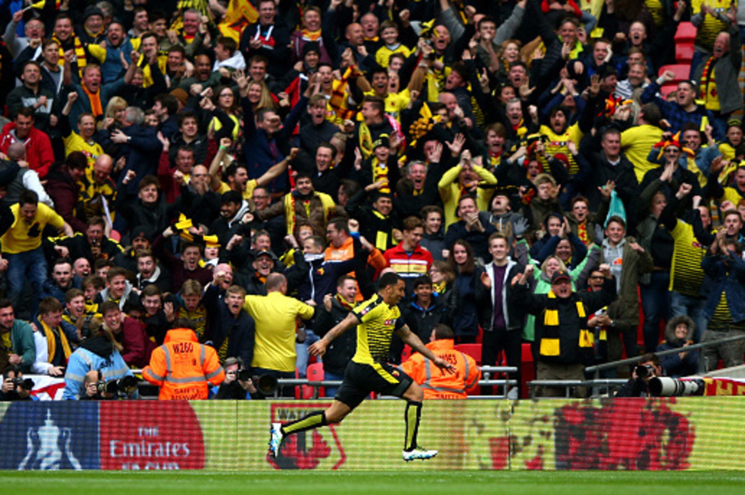 LONDON, ENGLAND - APRIL 24:  Troy Deeney of Watford celebrates with fans as he scores their first and equalising goal during The Emirates FA Cup semi final match between Watford and Crystal Palace at Wembley Stadium on April 24, 2016 in London, England.  