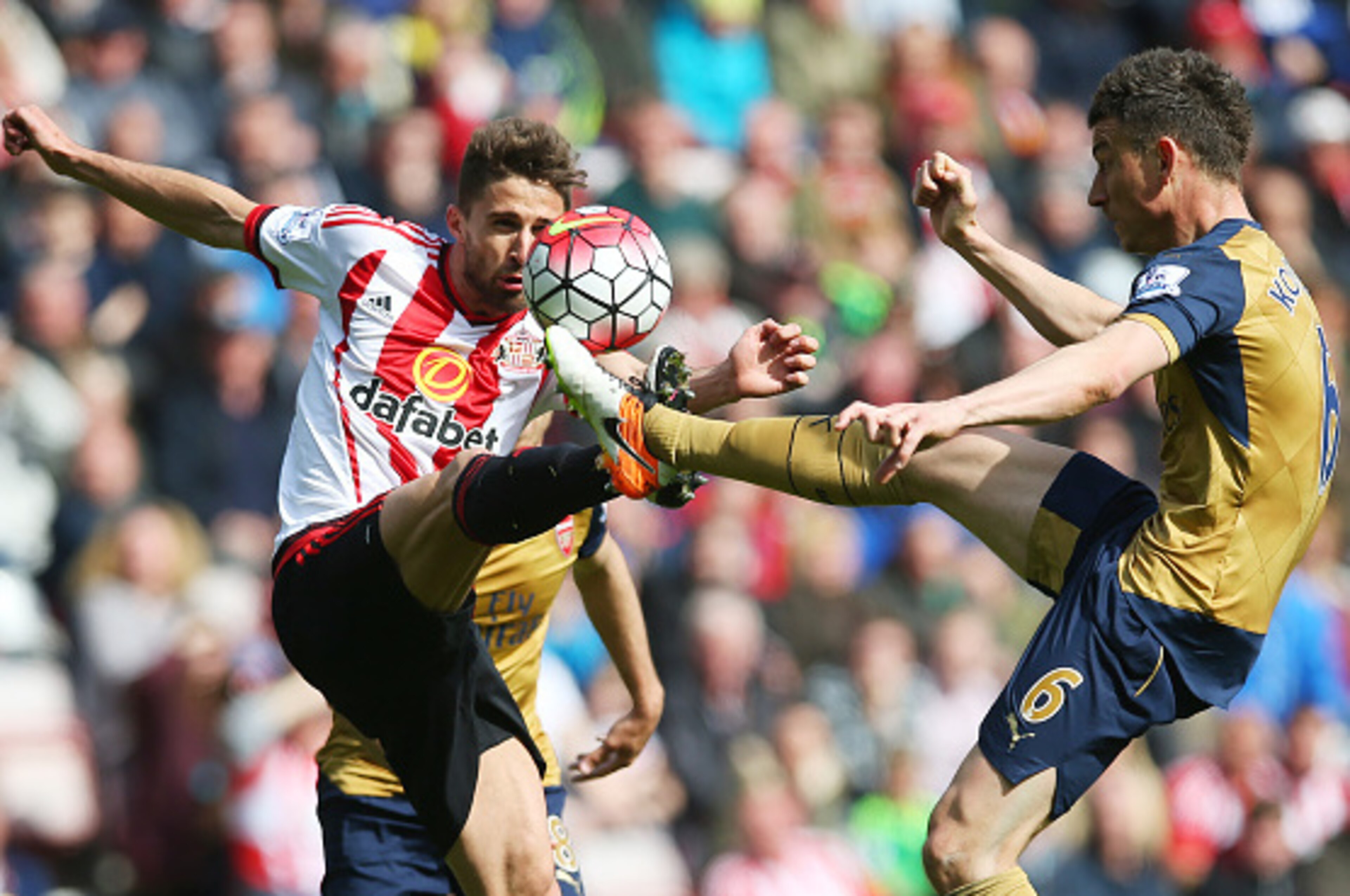 SUNDERLAND, ENGLAND - APRIL 24:  Laurent Koscielny of Arsenal vies with Fabio Borini of Sunderland during the Barclays Premier League match between Sunderland and Arsenal at The Stadium of Light on April 24, 2016 in Sunderland, England. (Photo by Ian MacN