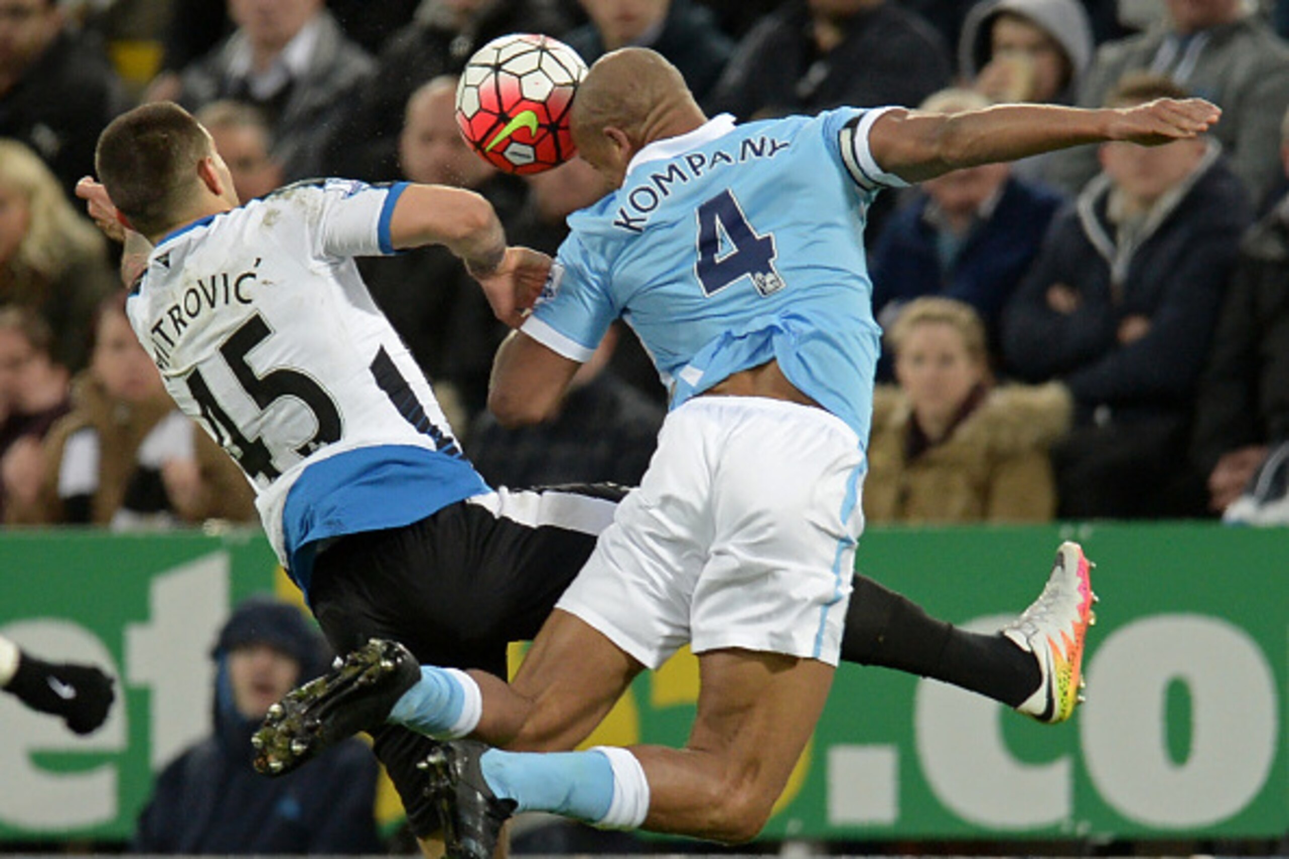 Manchester City's Belgian defender Vincent Kompany (R) vies with Newcastle United's Serbian striker Aleksandar Mitrovic during the English Premier League football match between Newcastle United and Manchester City at St James' Park in Newcastle-upon-Tyne,