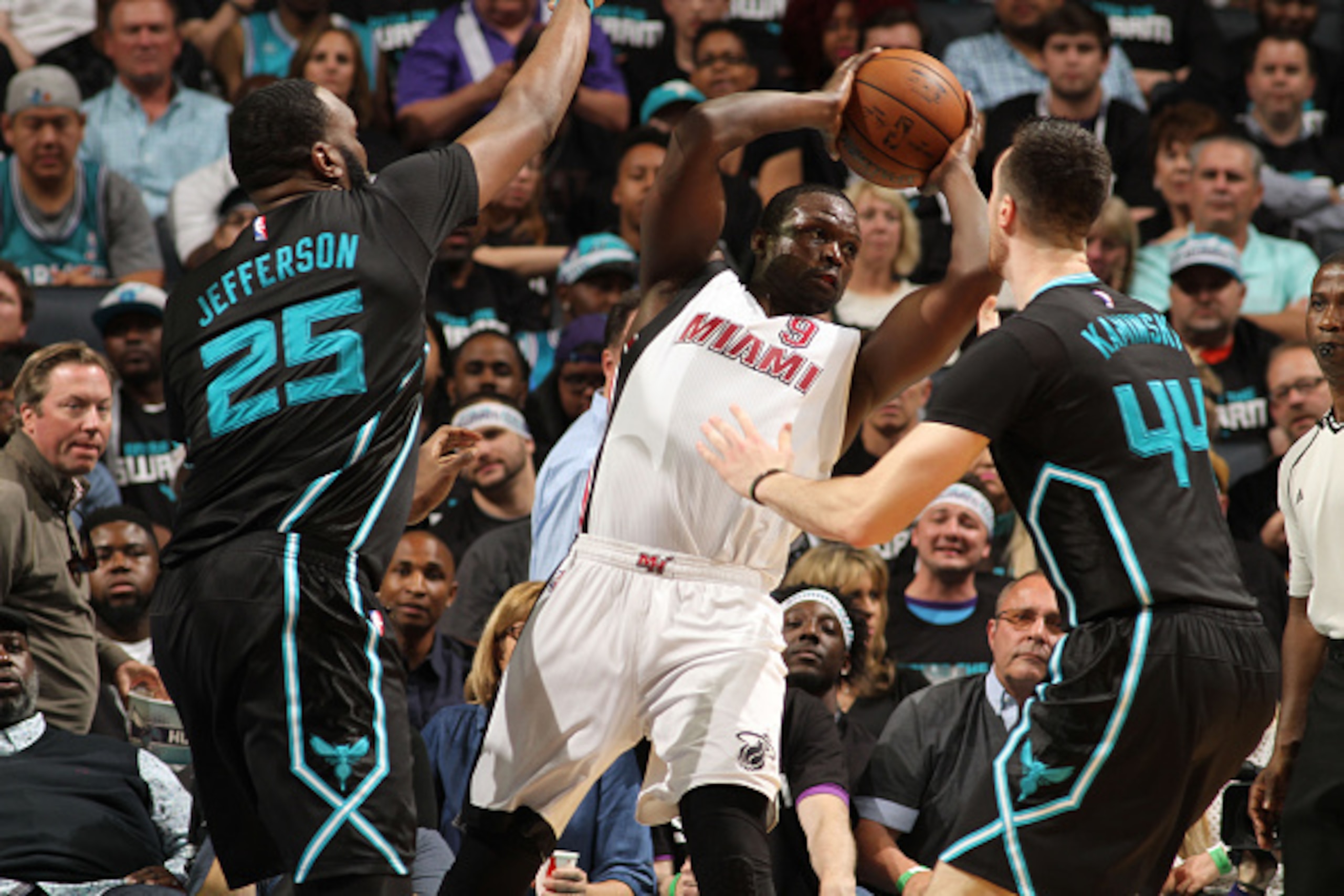 CHARLOTTE, NC - APRIL 23: Luol Deng #9 of the Miami Heat defends the ball against the Charlotte Hornets during Game Three of the Eastern Conference Quarterfinals during the 2016 NBA Playoffs on April 23, 2016 at Time Warner Cable Arena in Charlotte, Nor CHARLOTTE, NC - APRIL 23: Luol Deng #9 of the Miami Heat defends the ball against the Charlotte Hornets during Game Three of the Eastern Conference Quarterfinals during the 2016 NBA Playoffs on April 23, 2016 at Time Warner Cable Arena in Charlotte, Nor