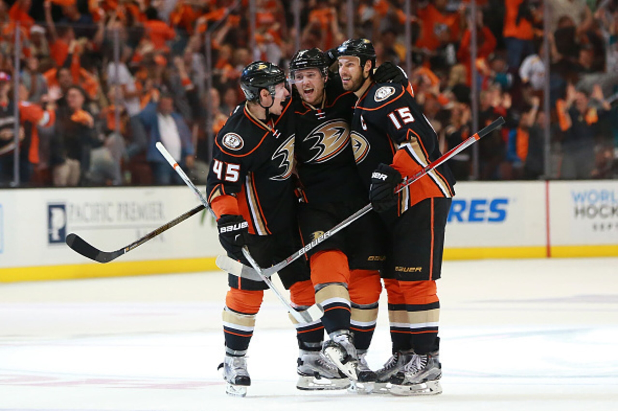 ANAHEIM, CA - APRIL 23: (L-R) Sami Vatanen #45, Cam Fowler #4 and Ryan Getzlaf #15 of the Anaheim Ducks celebrate Fowler's power-play goal at center ice in the third period of Game Five of the Western Conference First Round against the Nashville Predators