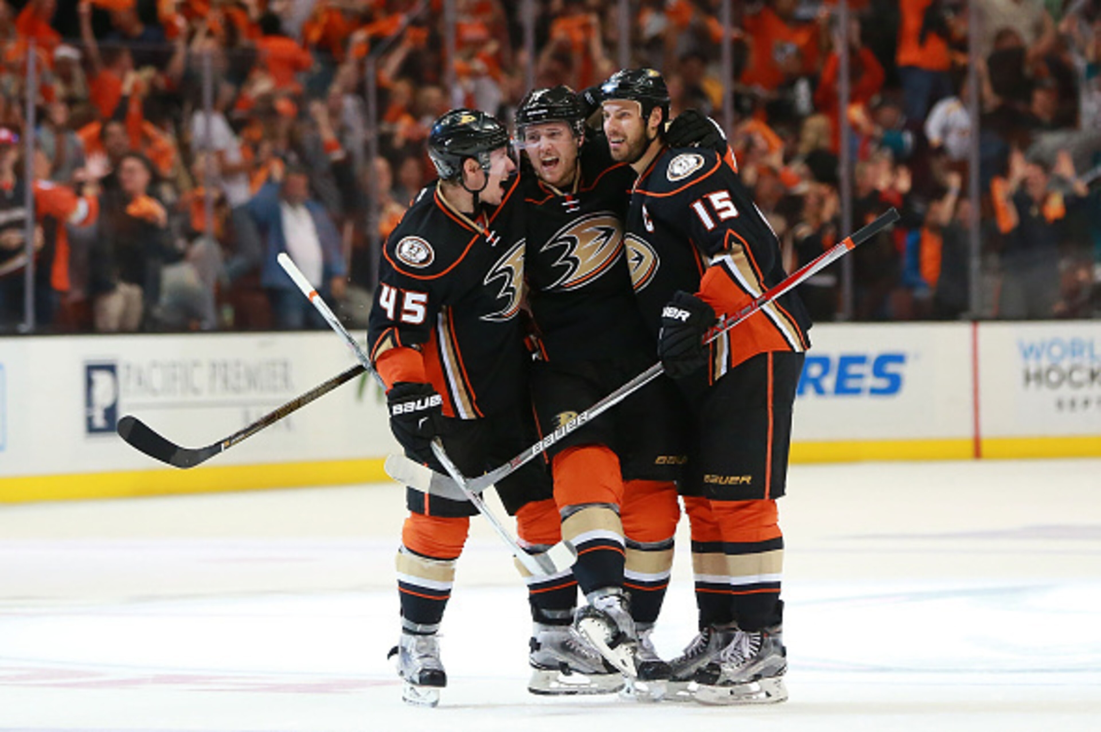 ANAHEIM, CA - APRIL 23: (L-R) Sami Vatanen #45, Cam Fowler #4 and Ryan Getzlaf #15 of the Anaheim Ducks celebrate Fowler's power-play goal at center ice in the third period of Game Five of the Western Conference First Round against the Nashville Predators