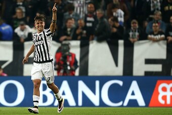 Juventus' forward Paulo Dybala from Argentina celebrates after scoring a penalty during the Italian Serie A football match Juventus Vs Lazio on April 20, 2016 at the 'Juventus Stadium' in Turin.  / AFP / MARCO BERTORELLO        (Photo credit should read M