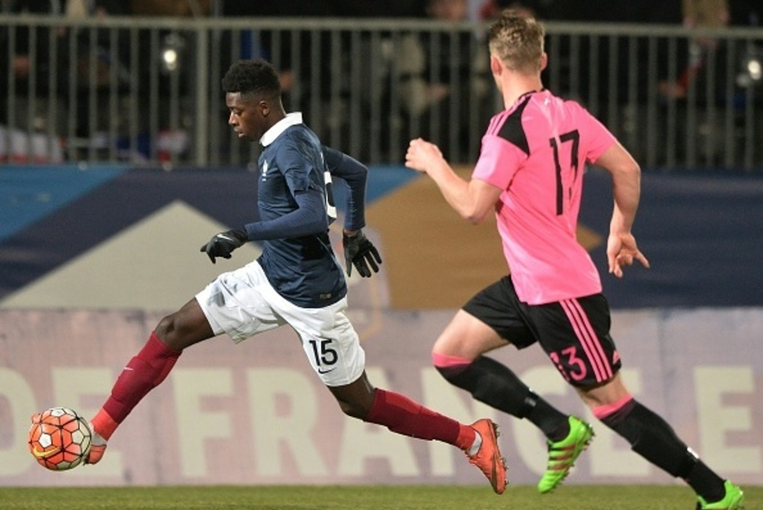France's forward Ousmane Dembele (L) vies with Scotland's defender Stephen Kingsley (R) during the UEFA Euro 2017 U21 Championship qualifying football match between France and Scotland, on March 24, 2016, in Jean Bouin Stadium, in Angers, northwestern Fra