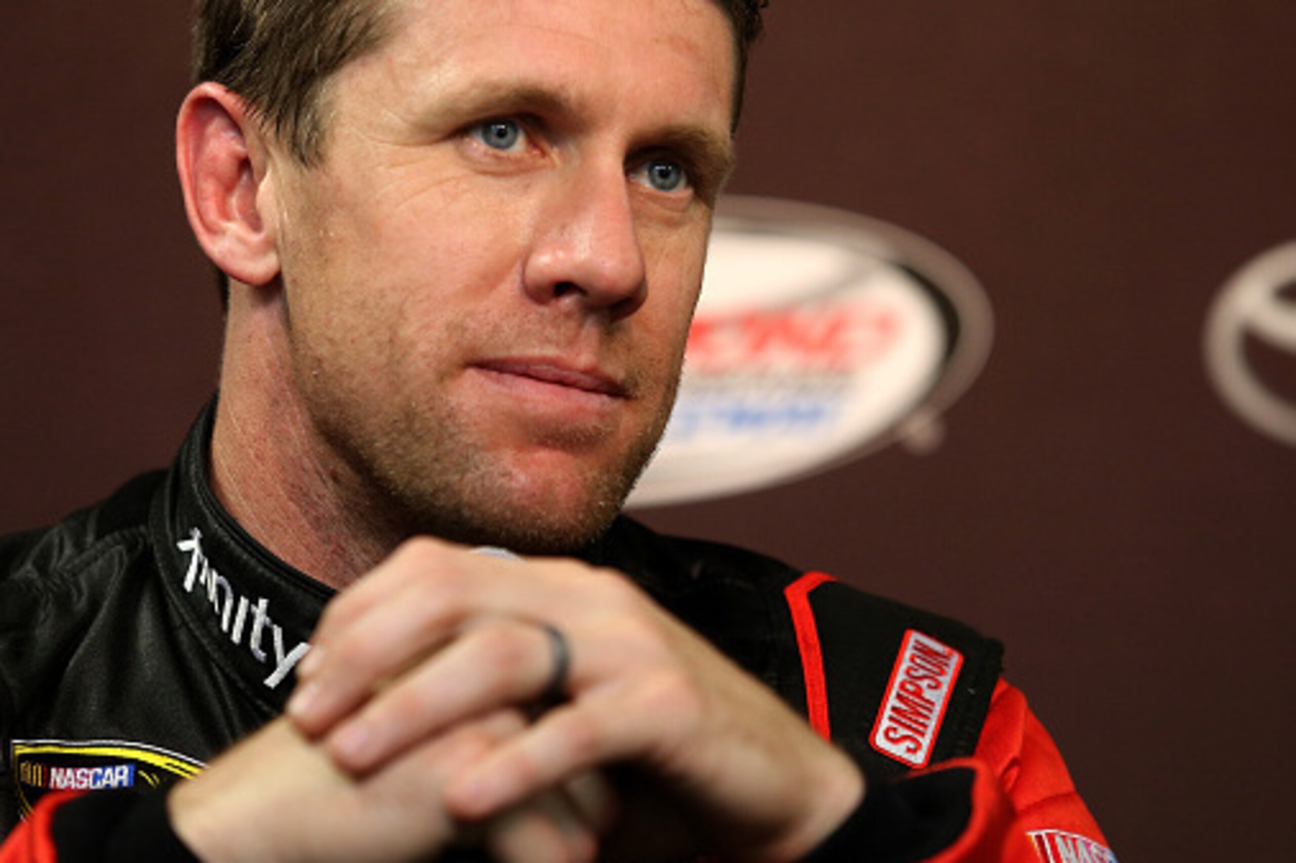 RICHMOND, VA - APRIL 22:  Carl Edwards, driver of the #19 XFINITY Toyota, speaks with the media after a practice for the NASCAR Sprint Cup Series TOYOTA OWNERS 400 at Richmond International Raceway on April 22, 2016 in Richmond, Virginia.  (Photo by Matt 