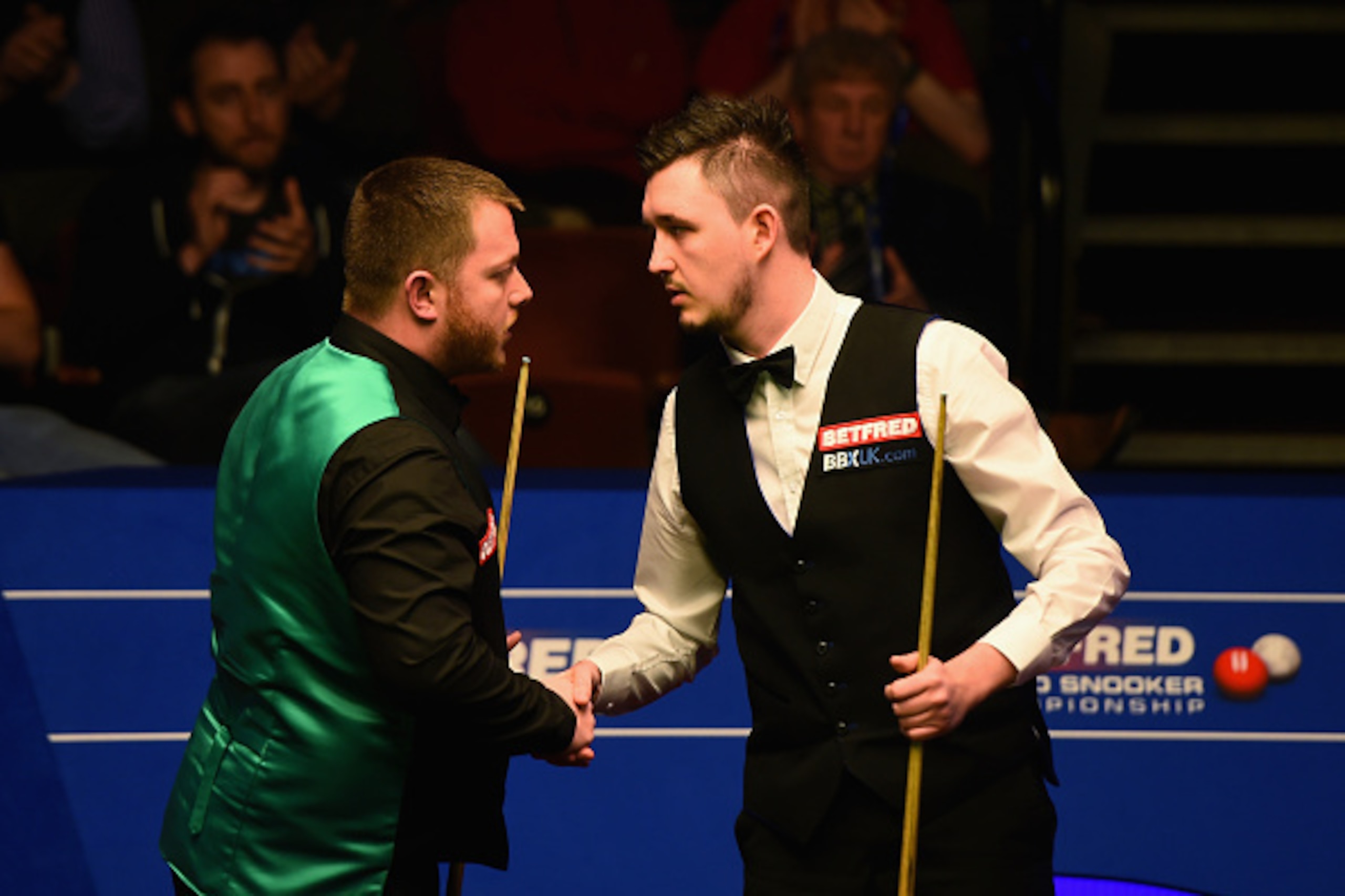 SHEFFIELD, ENGLAND - APRIL 25: Mark Allen (l) of Northern Ireland congratulates Kyren Wilson of England during their second round match on day ten of the World Snooker Championship at Crucible Theatre on April 25, 2016 in Sheffield, England.  (Photo by La