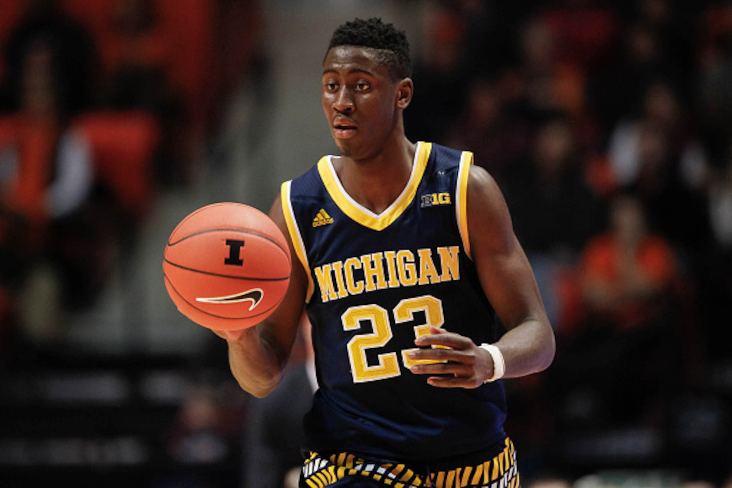 CHAMPAIGN, IL - DECEMBER 30: Caris LeVert #23 of the Michigan Wolverines brings the ball up court during the game against the Illinois Fighting Illini at State Farm Center on December 30, 2015 in Champaign, Illinois.  (Photo by Michael Hickey/Getty Images