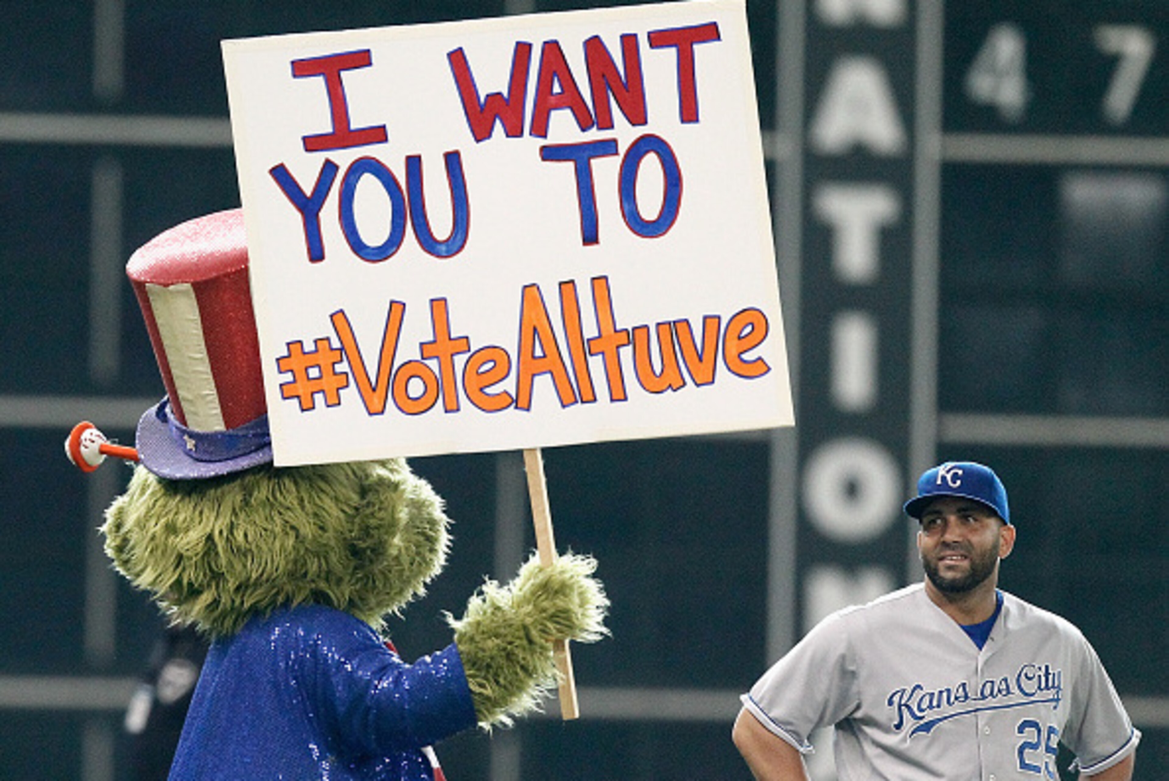 HOUSTON, TX - JUNE 29:  Kendrys Morales #25 of the Kansas City Royals looks at Houston Astros mascot Orbit as he campaigns for All-Star votes for Jose Altuve at Minute Maid Park on June 29, 2015 in Houston, Texas.  (Photo by Bob Levey/Getty Images)