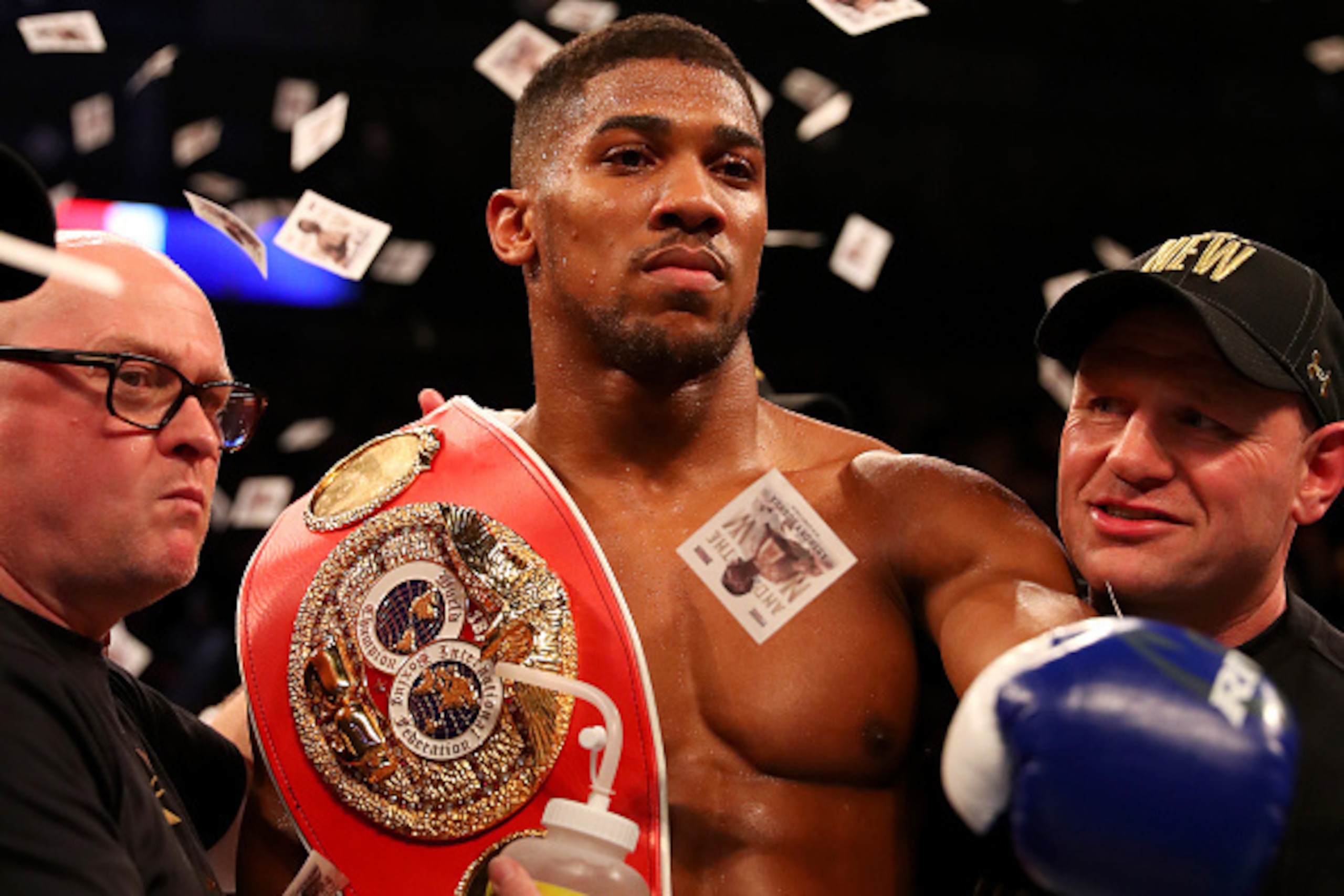 LONDON, ENGLAND - APRIL 09:  Anthony Joshua of England celebrates with the belt and his team after defeating Charles Martin of the United States in action during the IBF World Heavyweight title fight at The O2 Arena on April 9, 2016 in London, England.  (