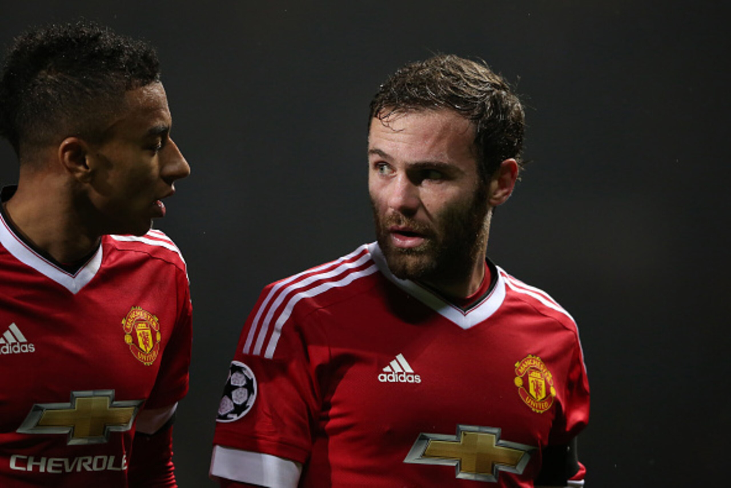 MANCHESTER, UNITED KINGDOM - NOVEMBER 03:  Jesse Lingard walks off with Juan Mata of Manchester United at the end of the first half during the UEFA Champions League match on November 3, 2015 in Manchester, United Kingdom.  (Photo by Matthew Ashton - AMA/G
