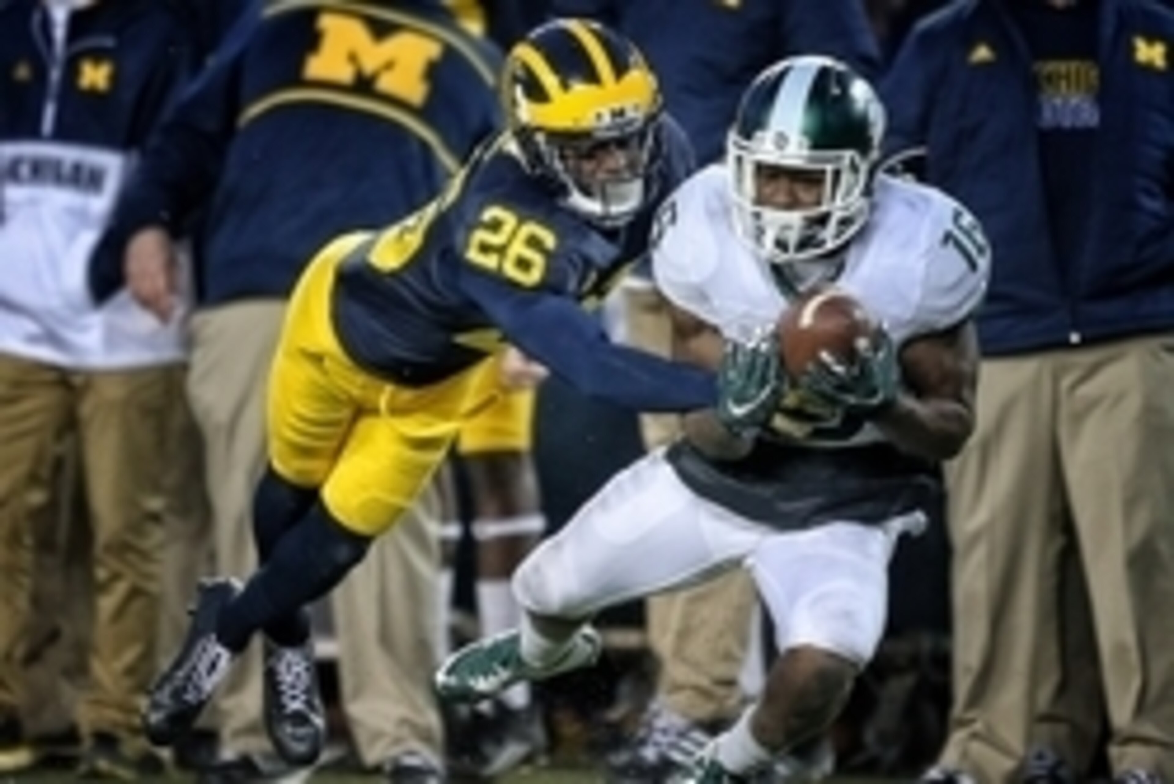 Oct 17, 2015; Ann Arbor, MI, USA; Michigan Wolverines cornerback Jourdan Lewis (26) defends against Michigan State Spartans wide receiver Aaron Burbridge (16) during the 2nd half of a game at Michigan Stadium. Mandatory Credit: Mike Carter-USA TODAY Sport